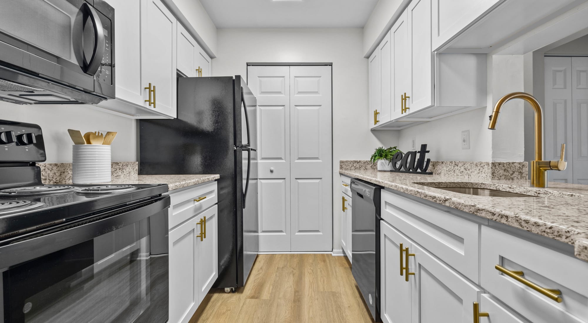 Model kitchen with modern appliances at Runaway Bay Apartments in Virginia Beach, Virginia