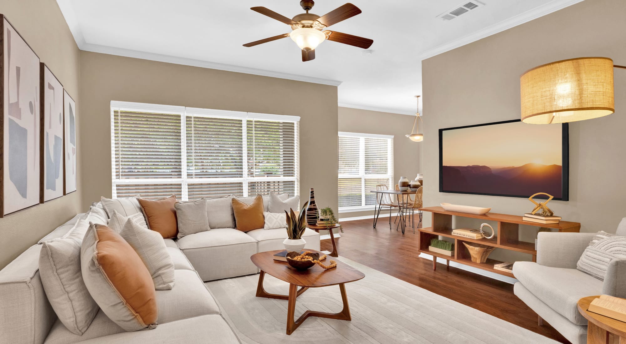 Living room with ceiling fan at Villas of Preston Creek