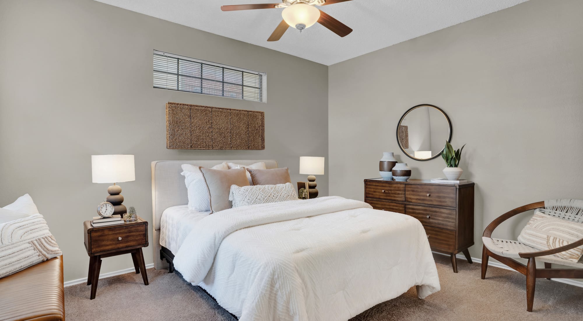 Bedroom with ceiling fan at Carrollton Park of North Dallas