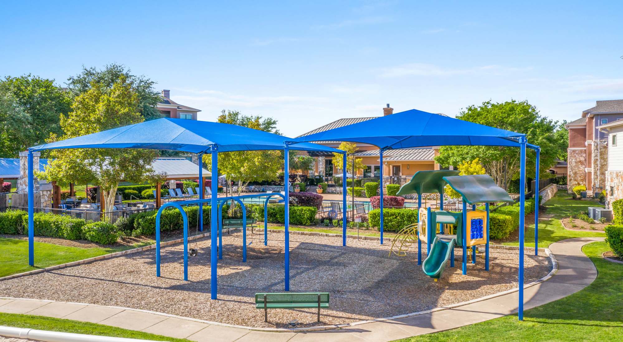 Playground with shade sail at Onion Creek