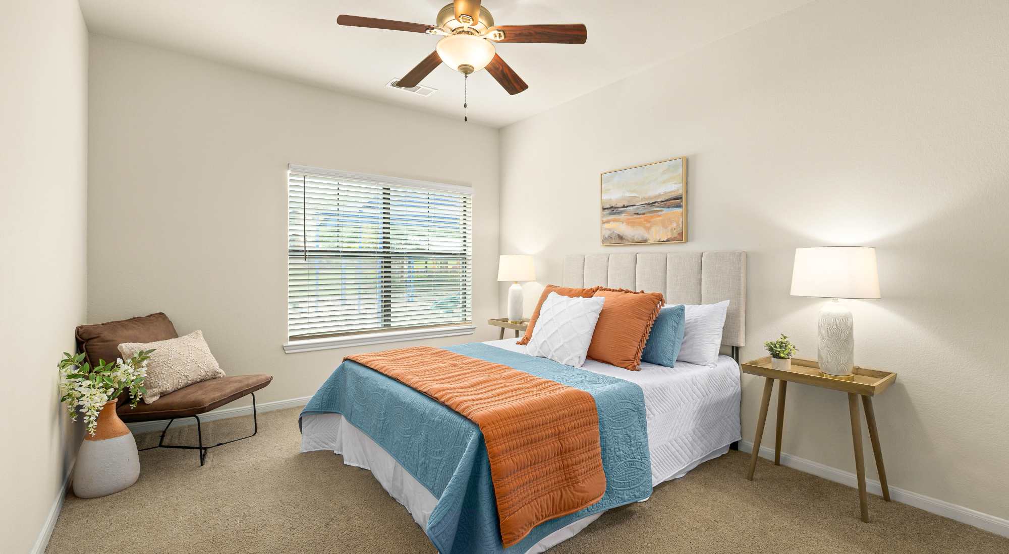 Bedroom with ceiling fan at Onion Creek