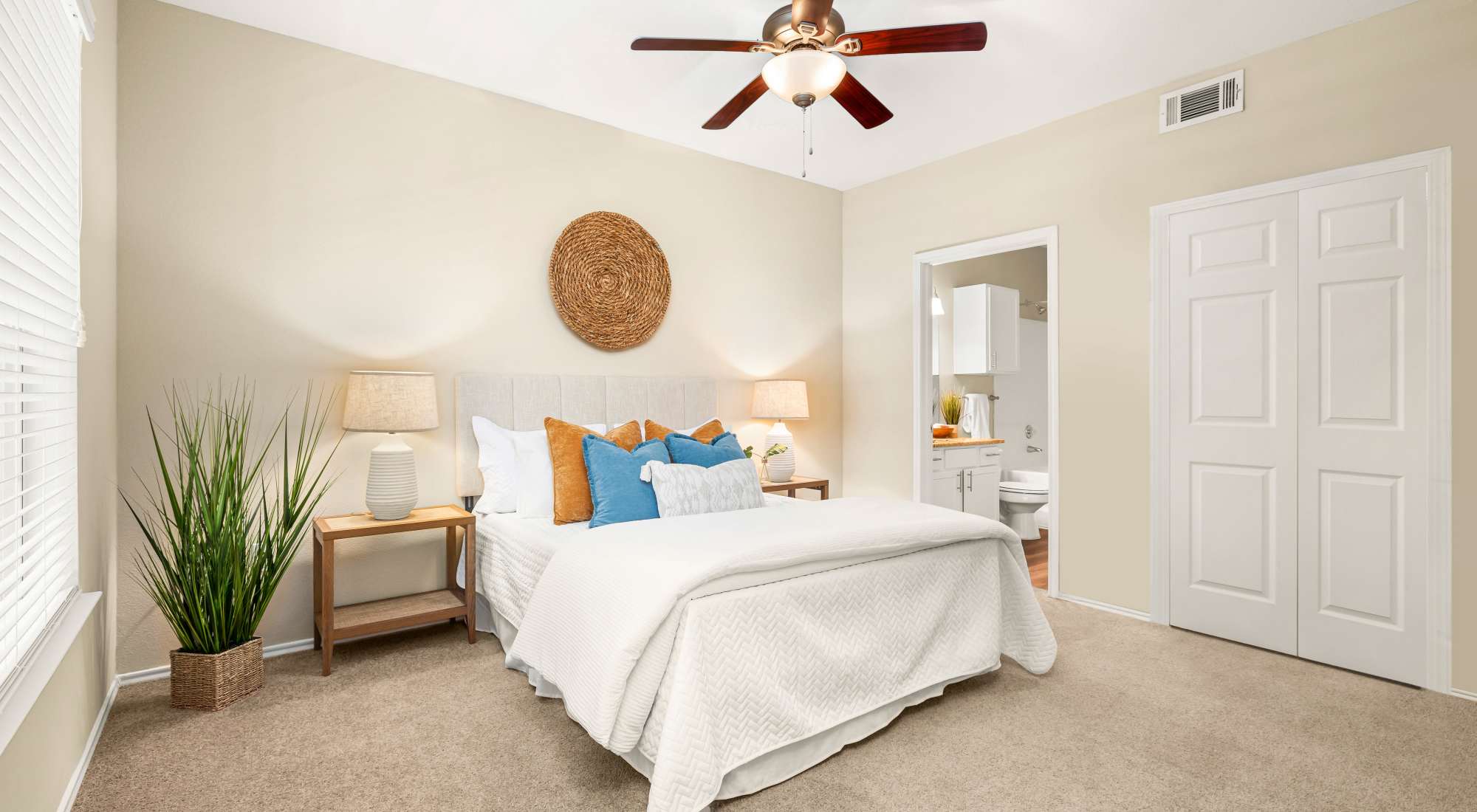 Bedroom with ceiling fan at The Lodge at Shavano Park