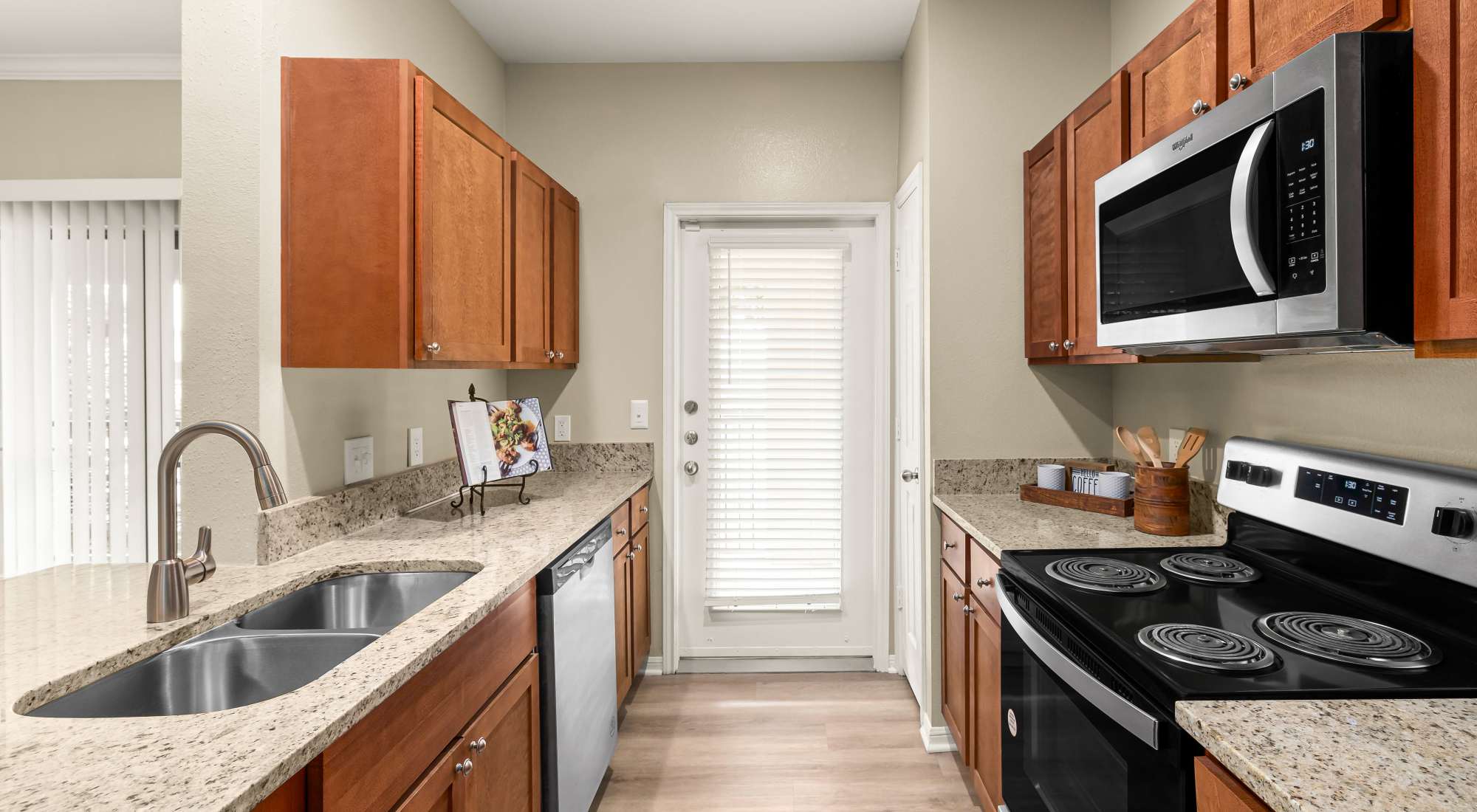 Kitchen with stainless steel appliances at Villas at Medical Center