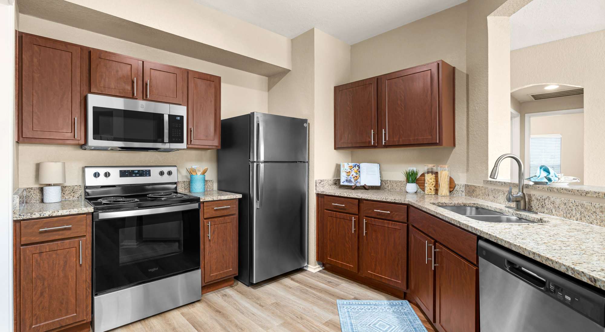 Kitchen with stainless steel appliances at Villas at Oakwell Farms