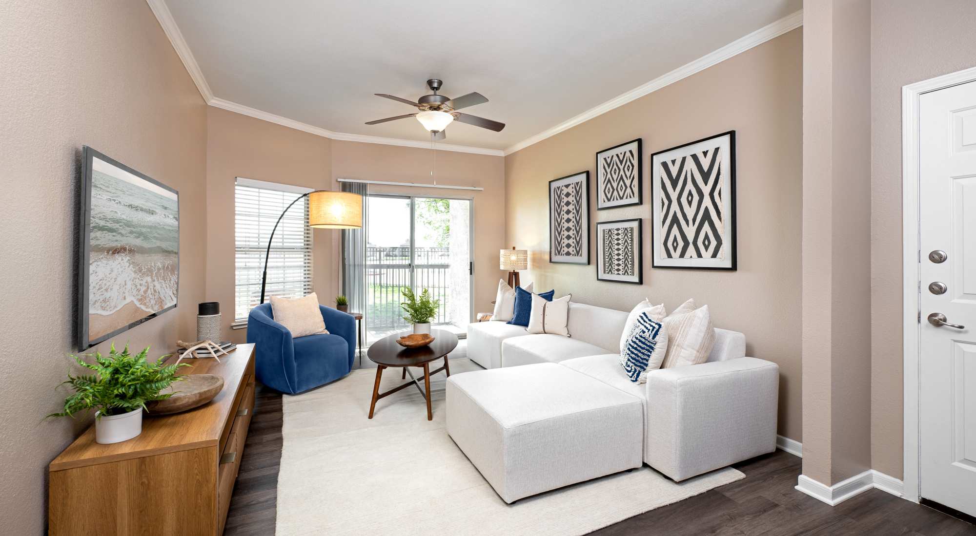 Living room with ceiling fan at Crescent Cove at Lakepointe
