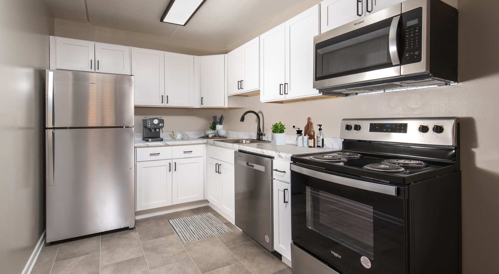 Kitchen with black appliances at Westover Pointe in Wilmington, Delaware