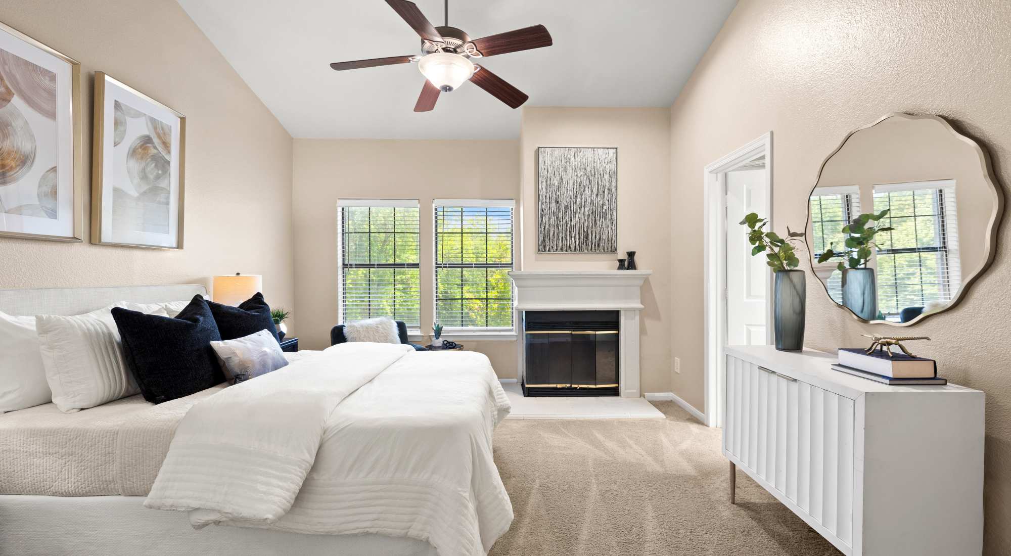 Bedroom with fireplace at Villas at Parkside