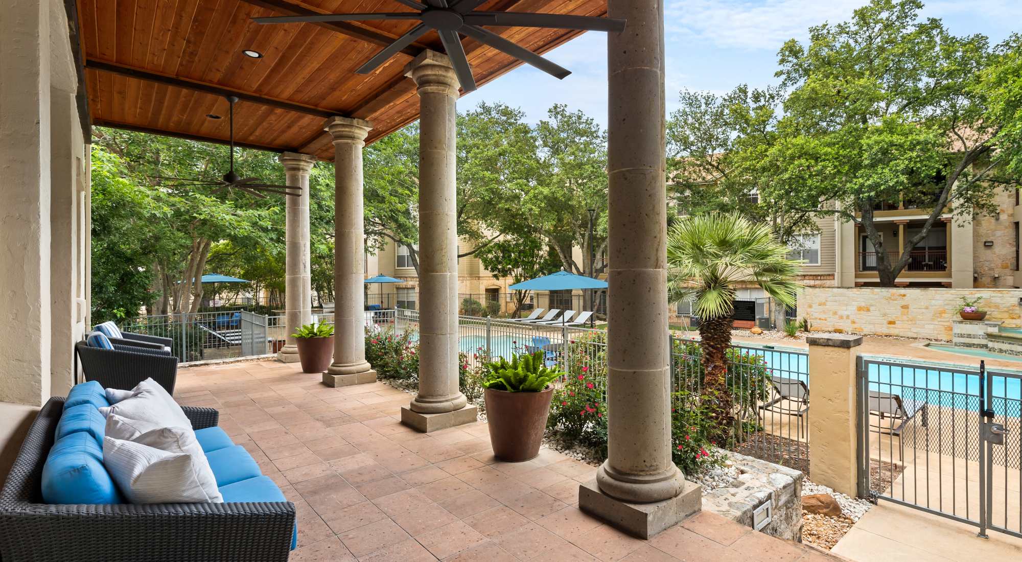 Lounge area next to the pool at Sedona Ranch Apartments in San Antonio, Texas