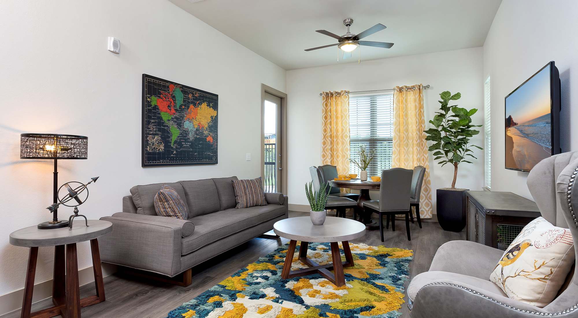 Living room with ceiling fan at Villas at the Rim
