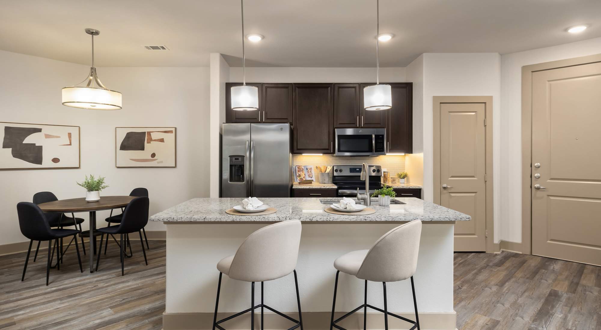 View of kitchen and island with bar stools at Villas at the Rim