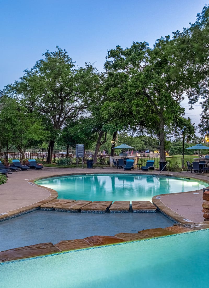 Outdoor swimming pool at sunset at The Marquis at Brushy Creek in Austin, Texas
