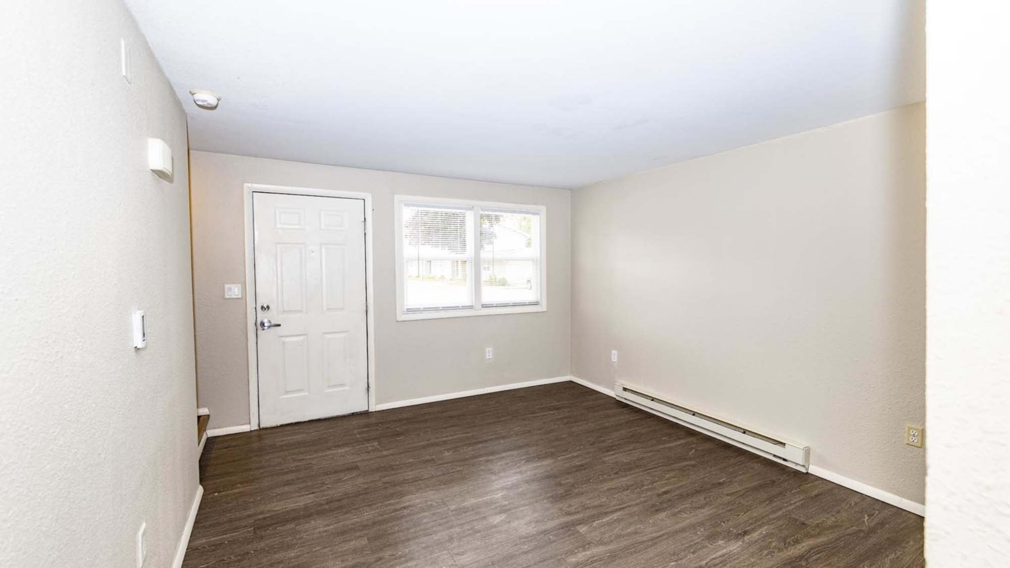 Well-lit living room at Taylor Crossing in Green Bay, Wisconsin