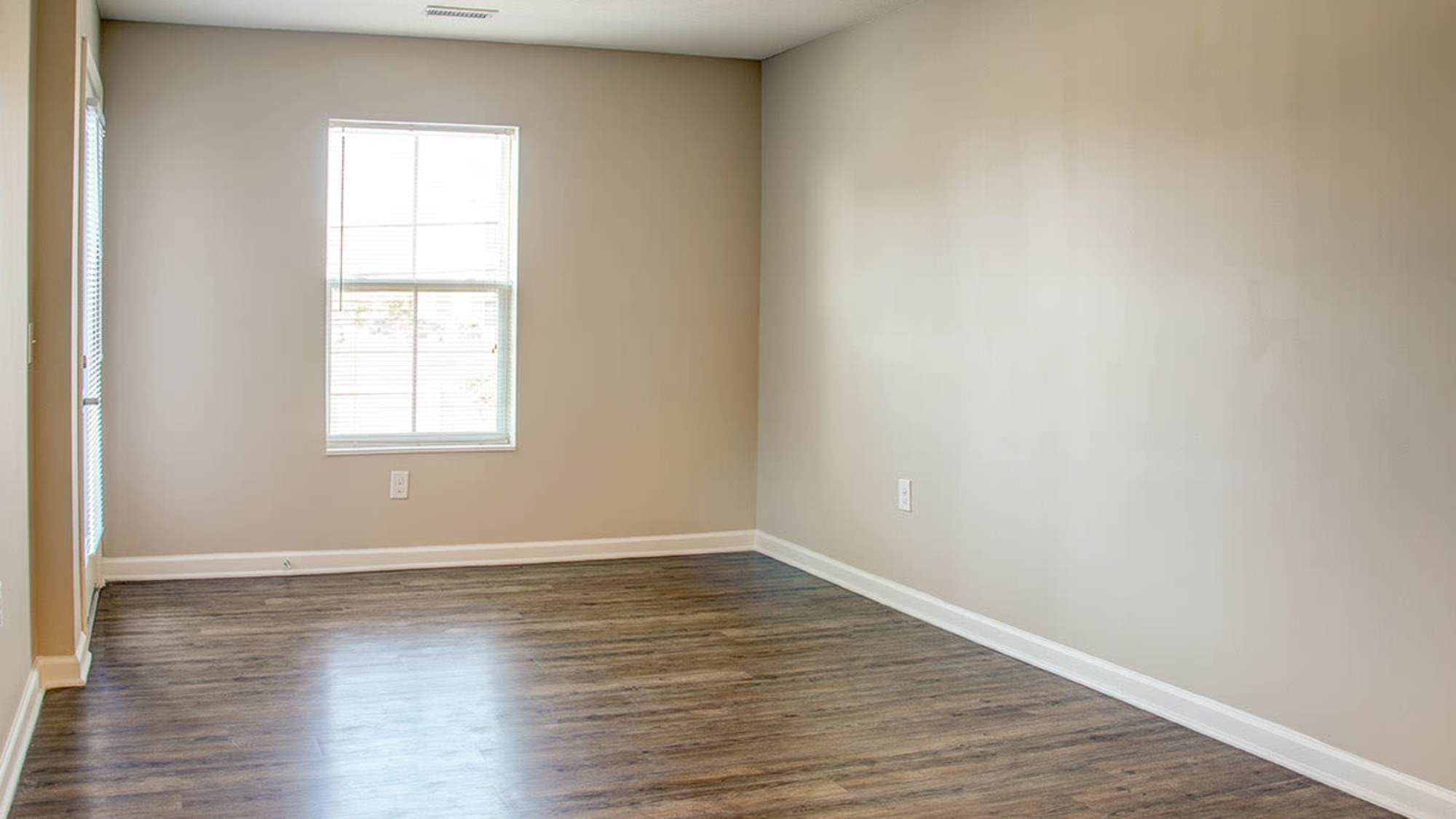 Well-lit bedroom room at Brennan Pointe I in Newport News, Virginia