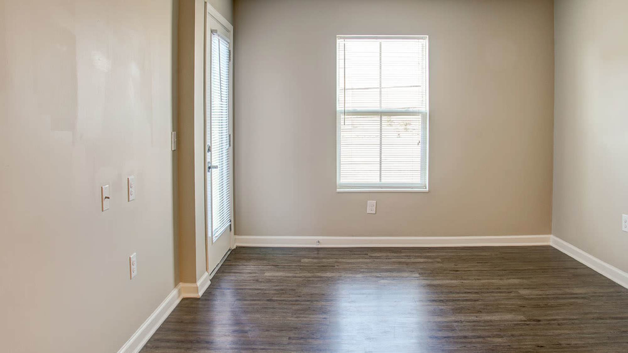 Bedroom with wood-style flooring at Brennan Pointe I in Newport News, Virginia