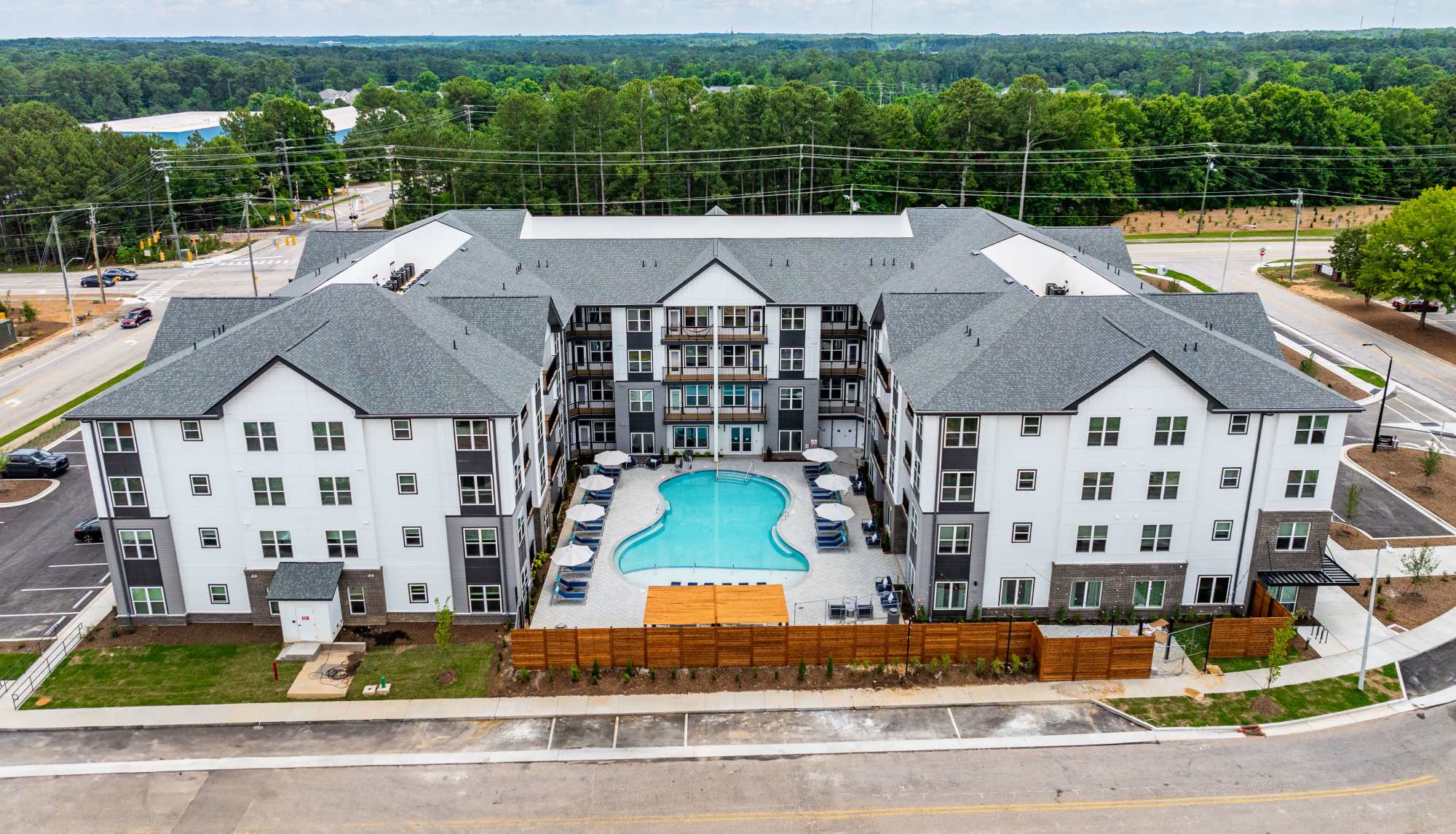 Aerial view of apartment community featuring resort-style pool at Ironwood on North Salem in Apex, North Carolina