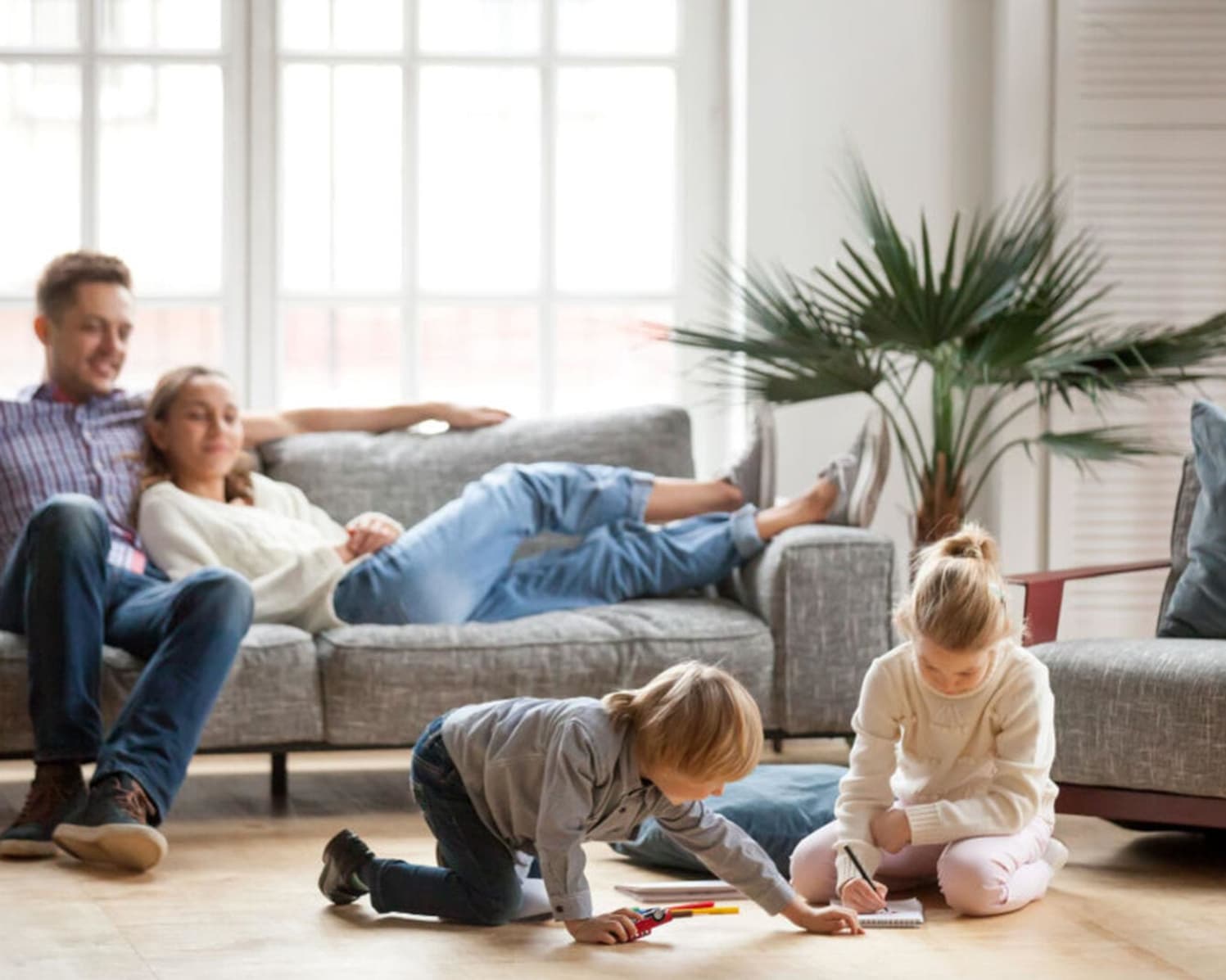 Family relaxing in their home at Cadence at Bluff Park in Hoover, Alabama