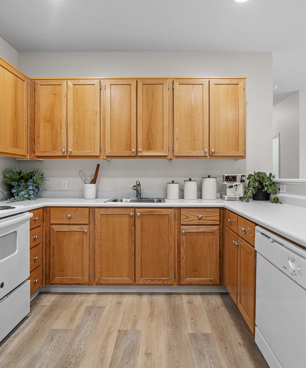 Model home's kitchen with ample natural light at Avery at Orenco Station in Hillsboro, Oregon