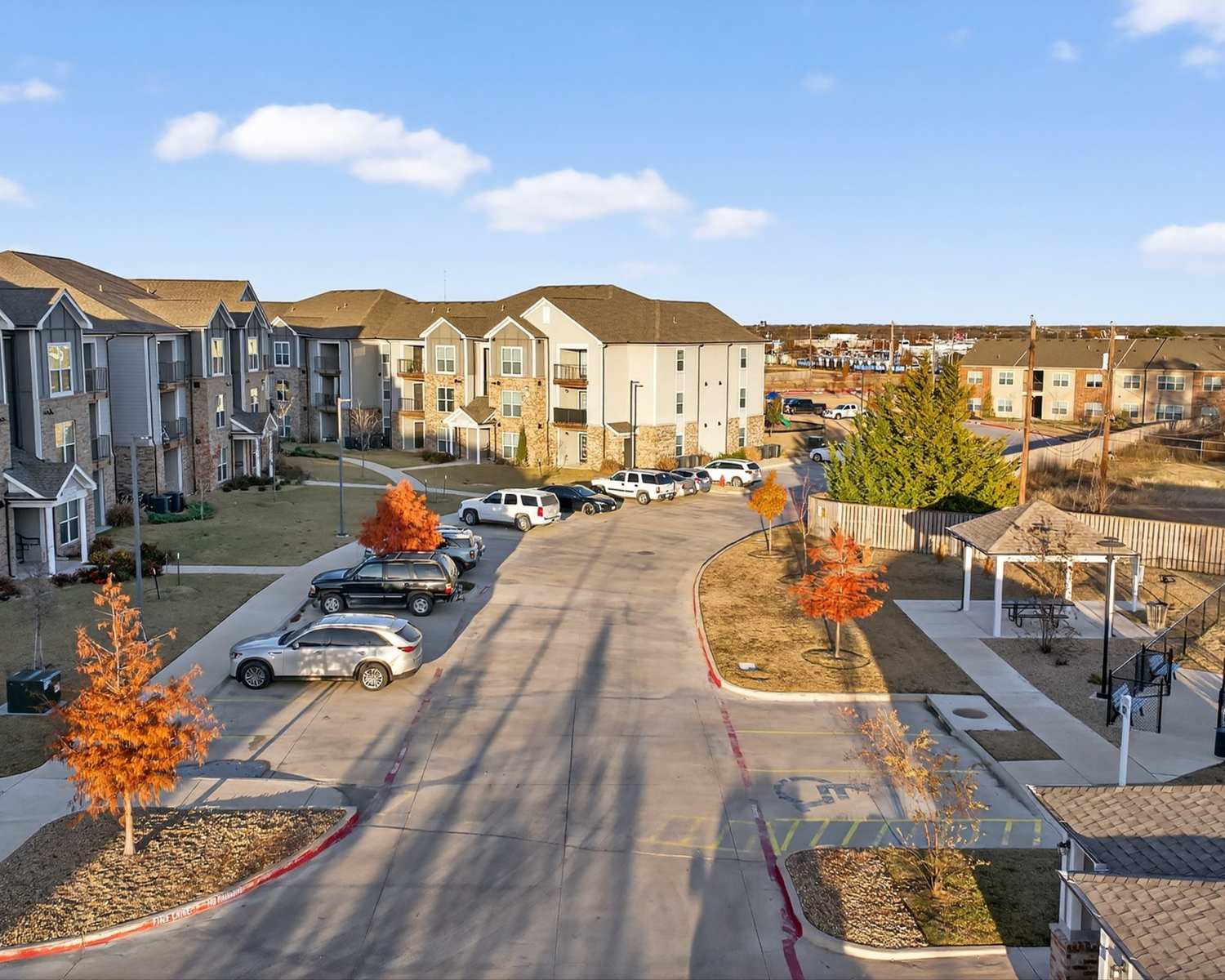 Apartment view with car parking to Juniper Pointe in Kaufman, Texas