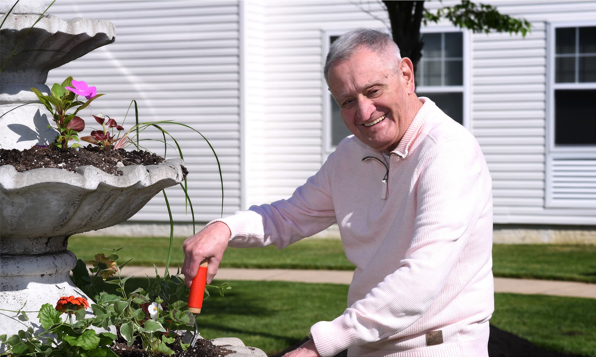 Resident gardening at Mattison Crossing at Manalapan Avenue in Freehold, New Jersey.