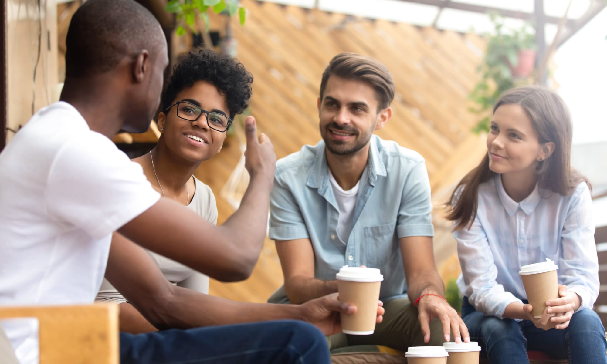 Friends enjoying coffee in Jackson, Mississippi near Summer Park Apartments