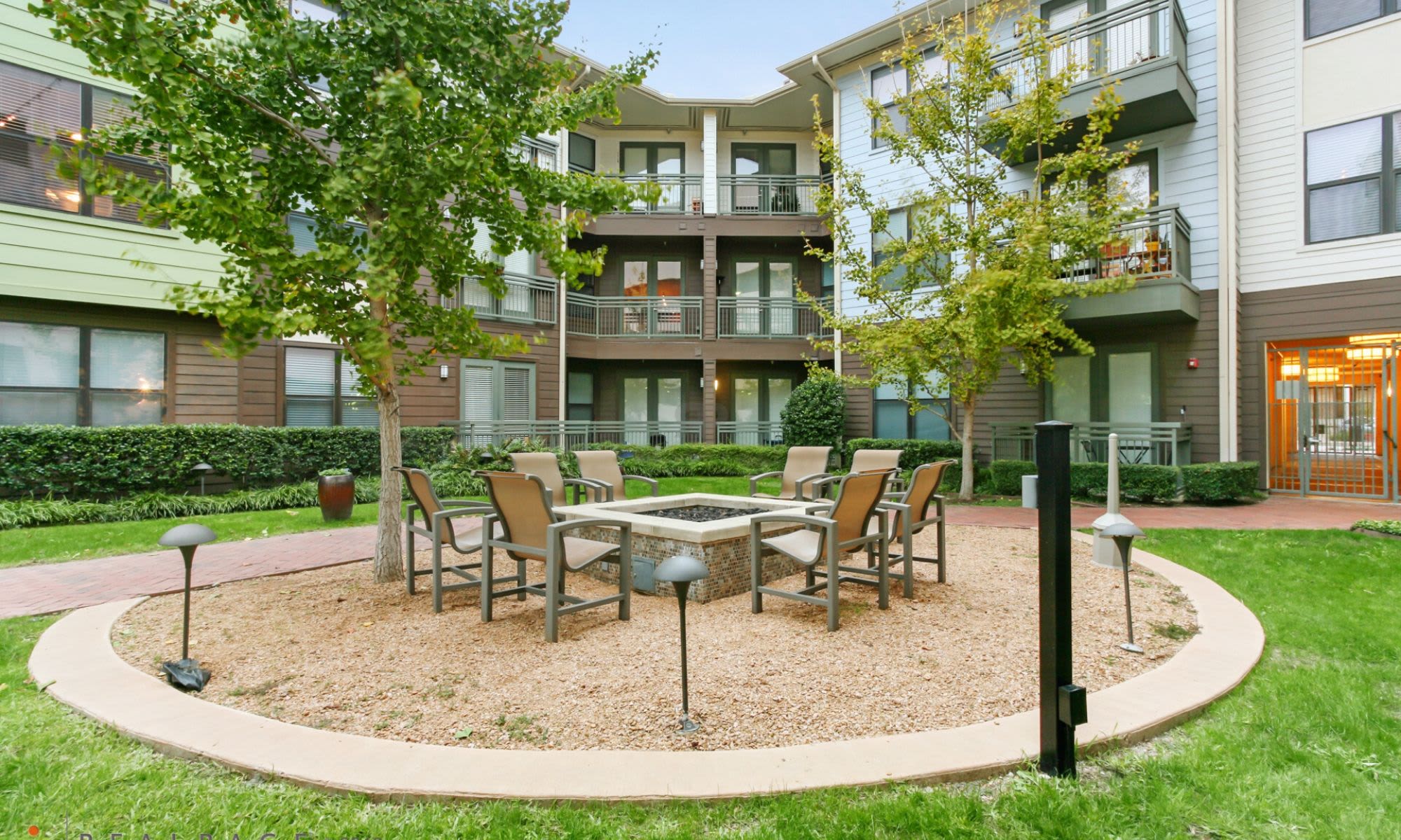 Outdoor seating available at 5th Street Crossing at City Station in Garland, Texas