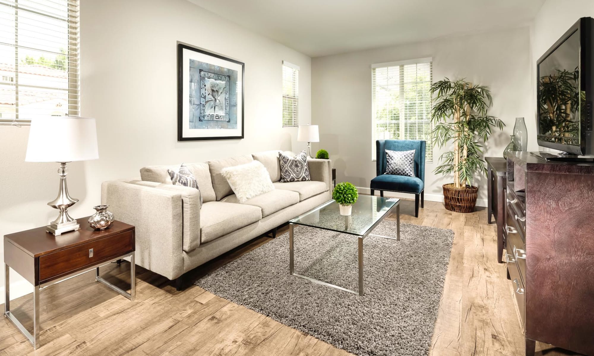 Living room with glass coffee table at Mission Hills in Camarillo, California
