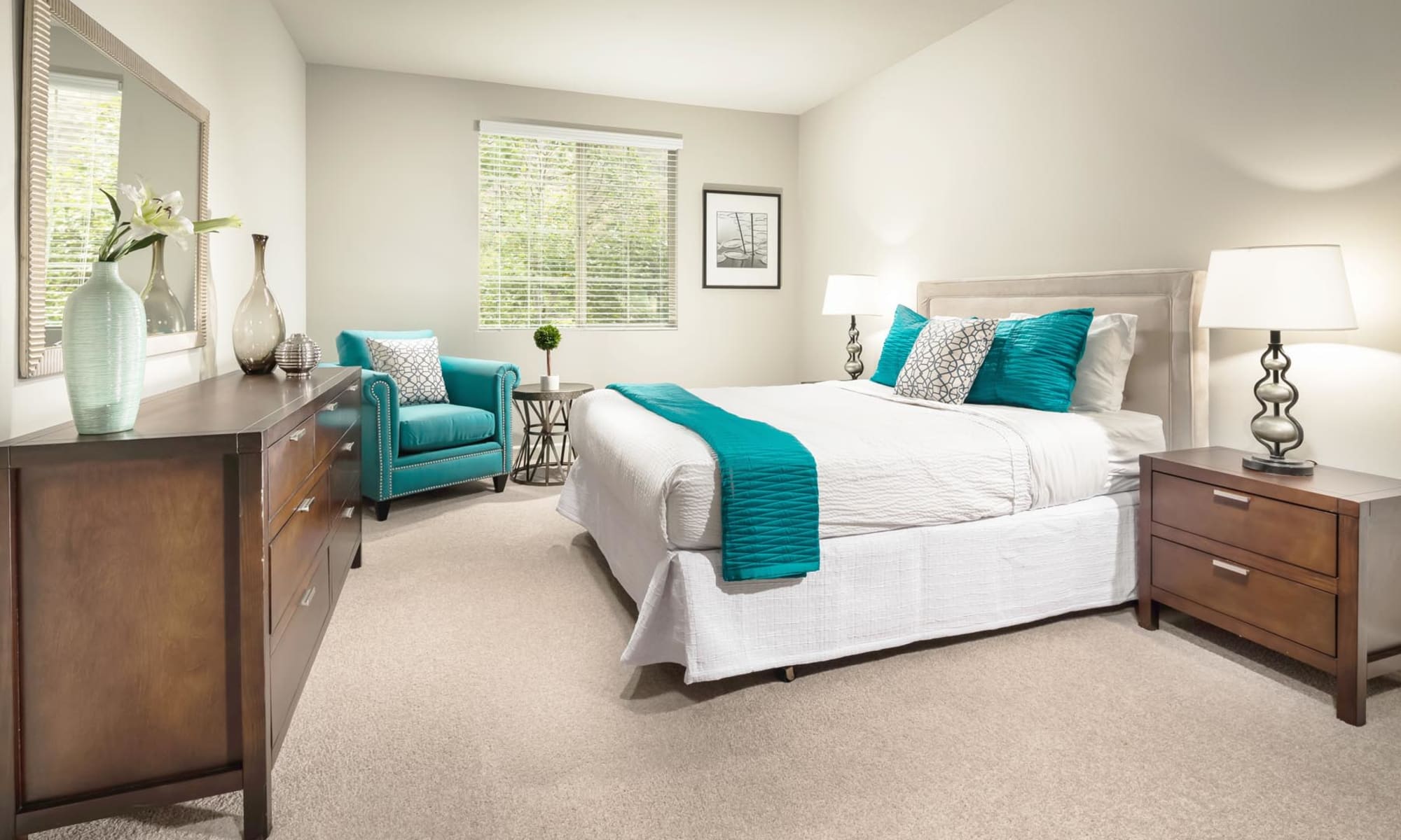 Spacious primary bedroom with plush carpeting in a model home at Mission Hills in Camarillo, California