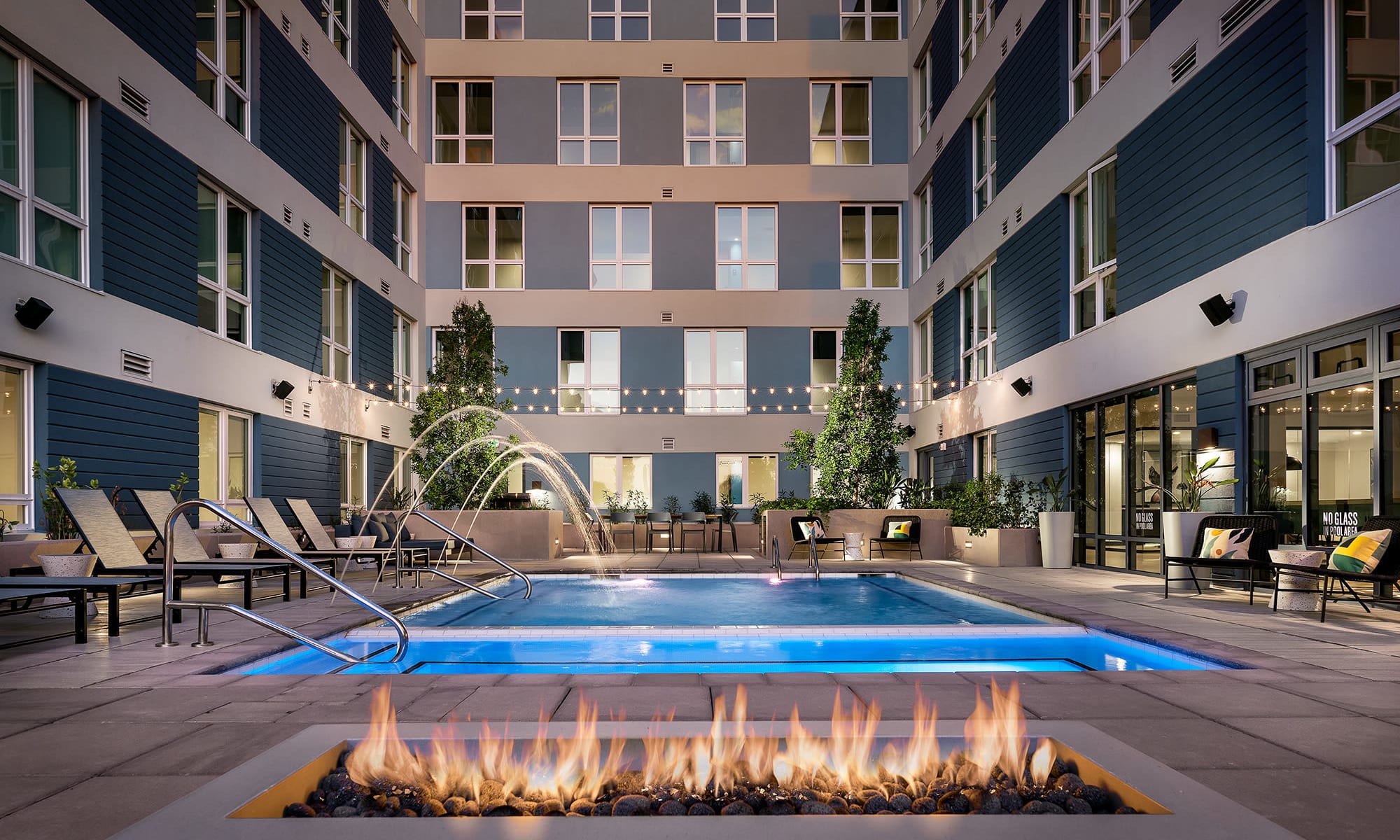 Fireplace and swimming pool at Hudson on Farmer in Tempe, AZ