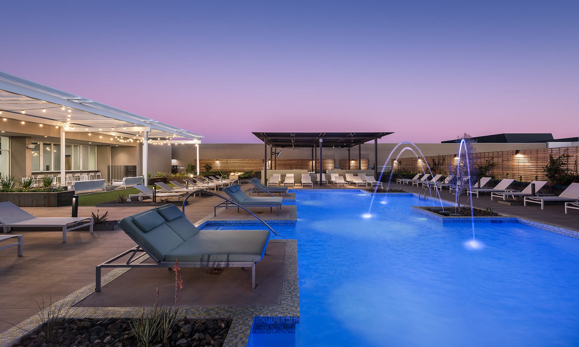 Resort-style swimming pool and outdoor amenity area at The Piedmont in Tempe, Arizona