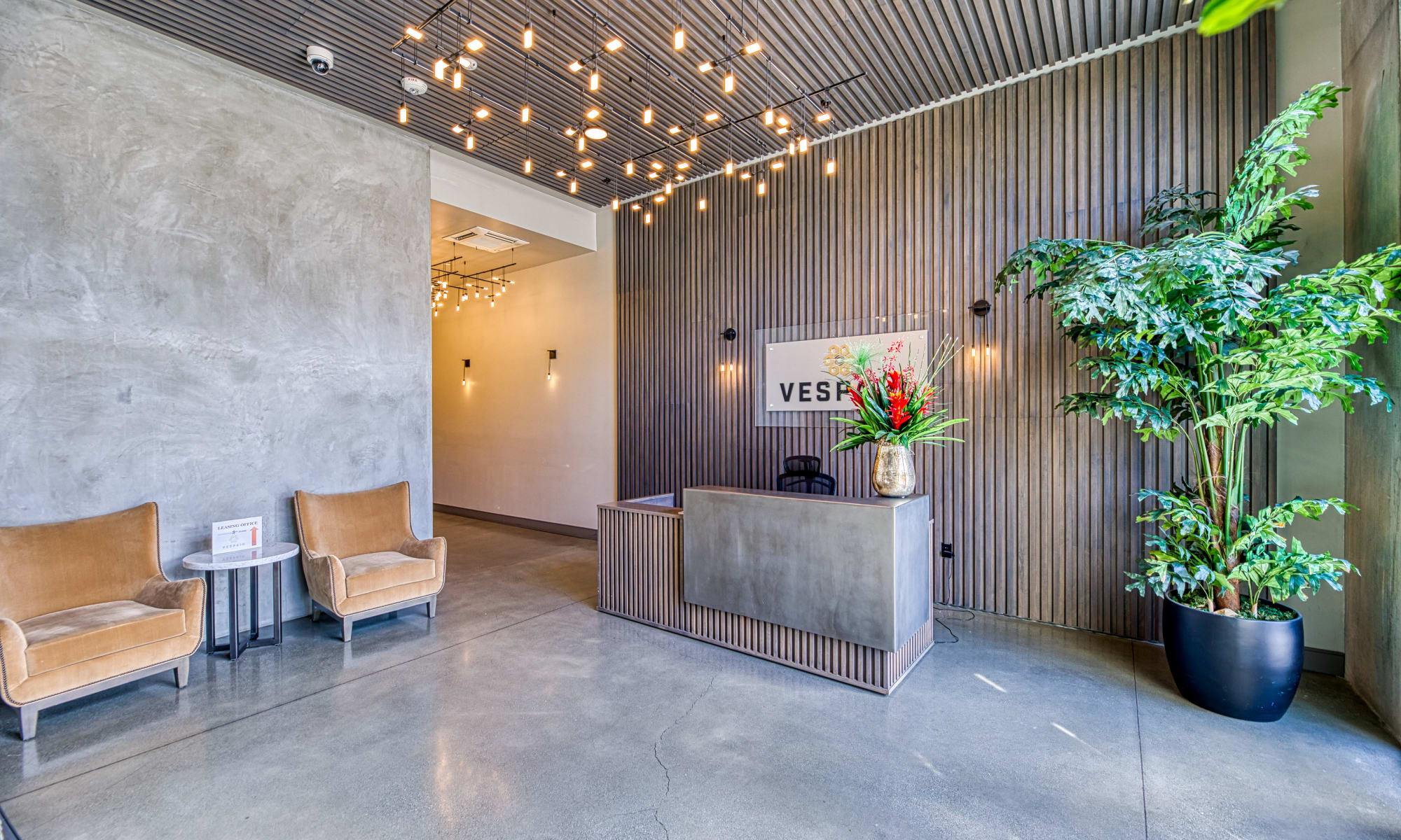 Sitting area and front desk at lobby of Vespaio in San Jose, California