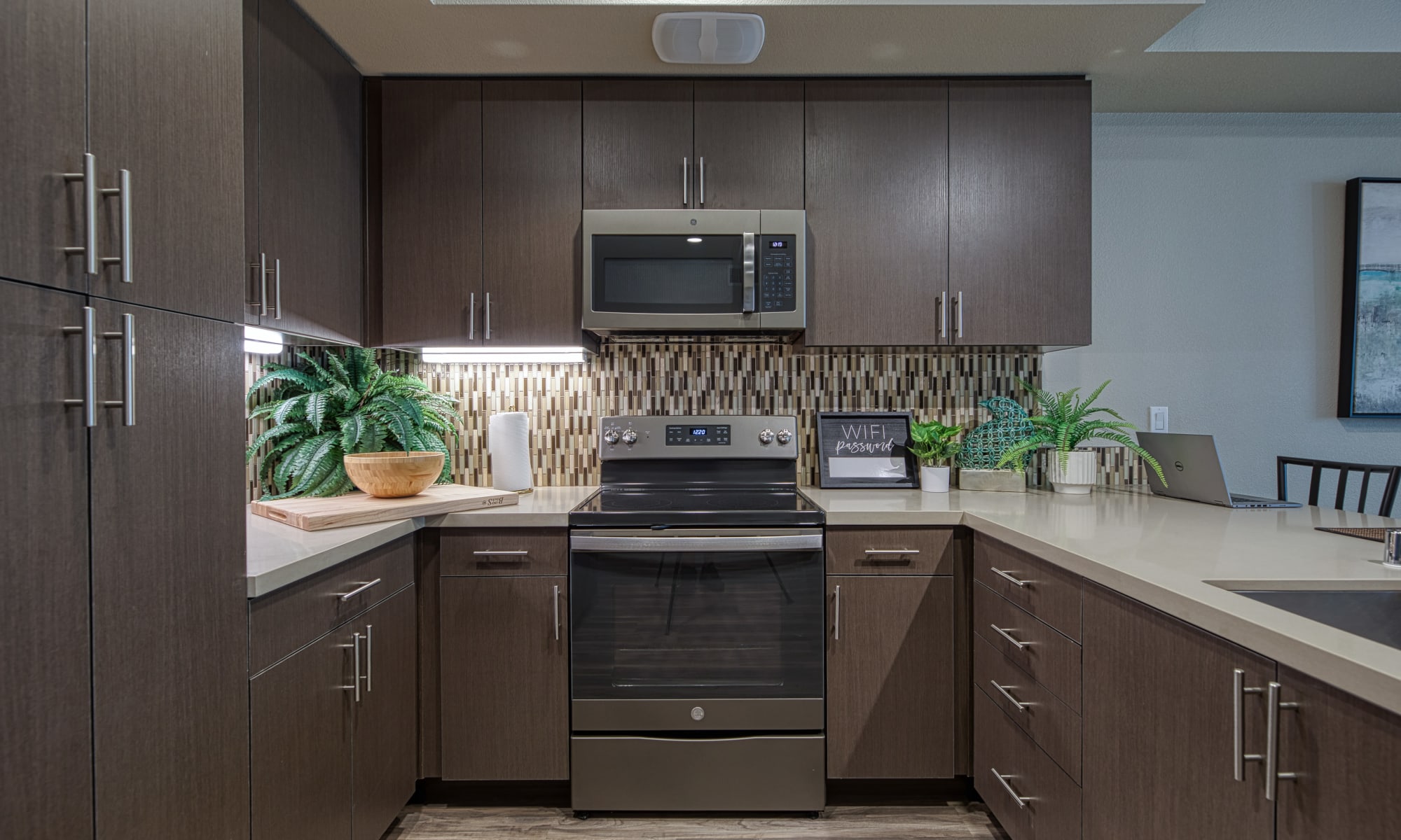 Vespaio in San Jose, California features a kitchen with dark cabinets and ample storage