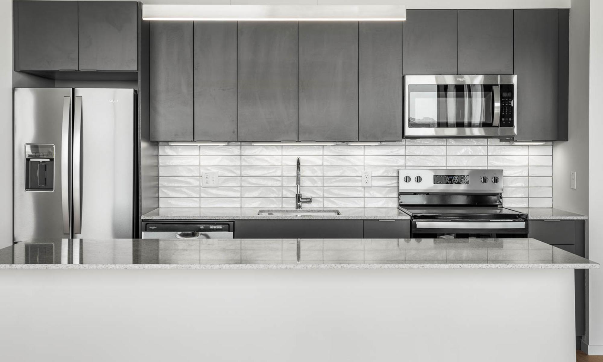 Luxury stainless steel appliances and large island at PALMtower in Phoenix, Arizona