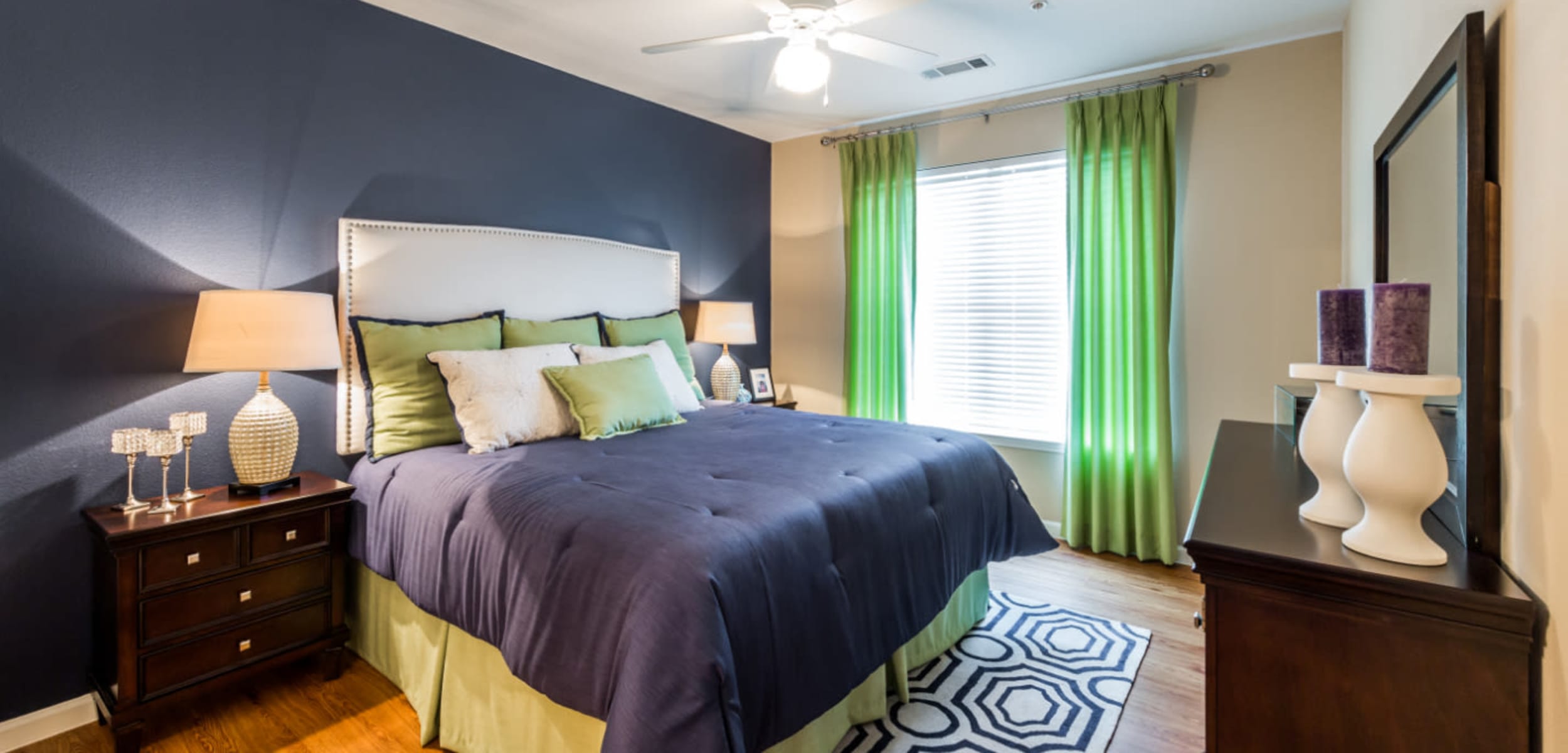 Bedroom with a large window at Marquis at Canyon Ridge in Austin, Texas