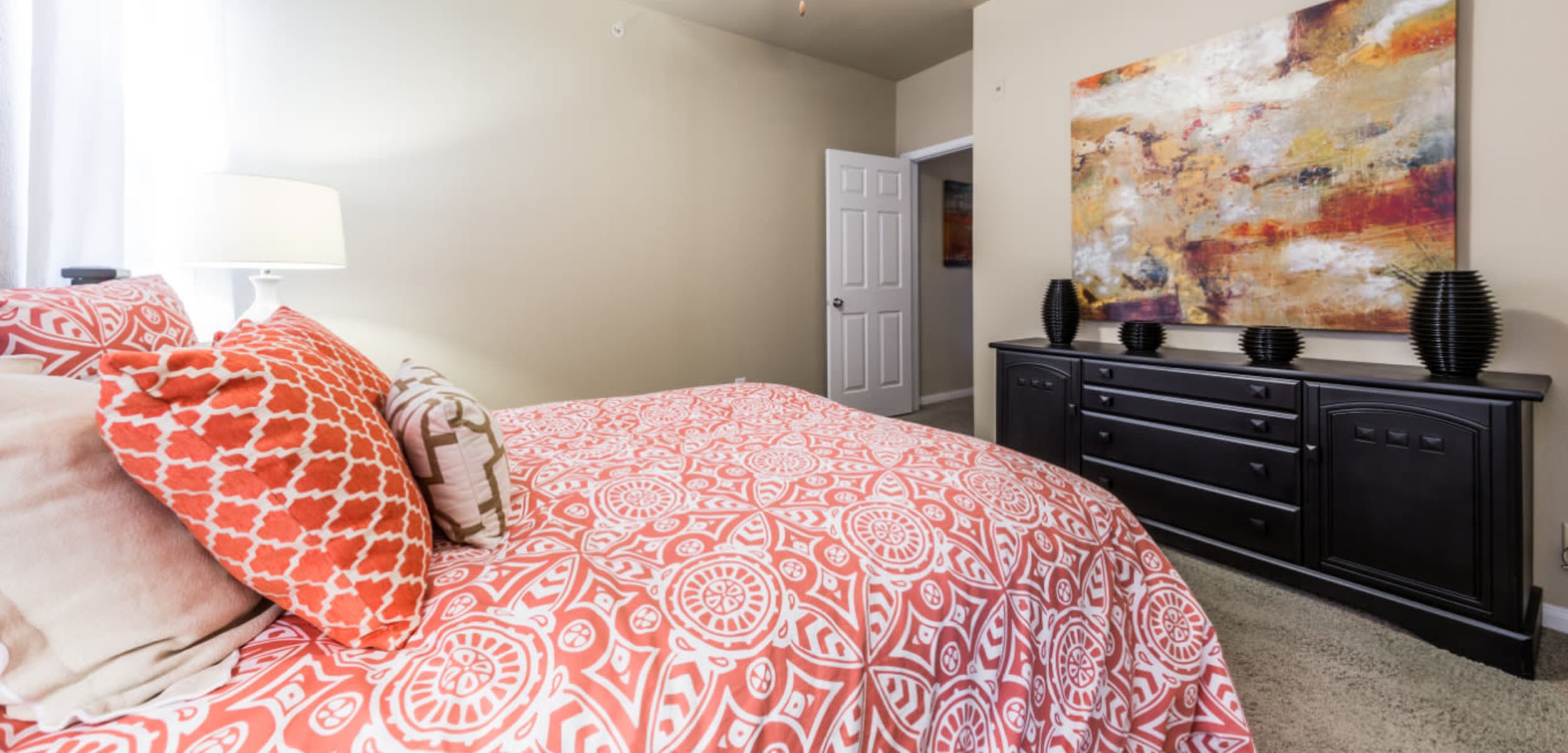 Spacious bedroom with carpet and ceiling fan at Marquis at Stonegate in Fort Worth, Texas
