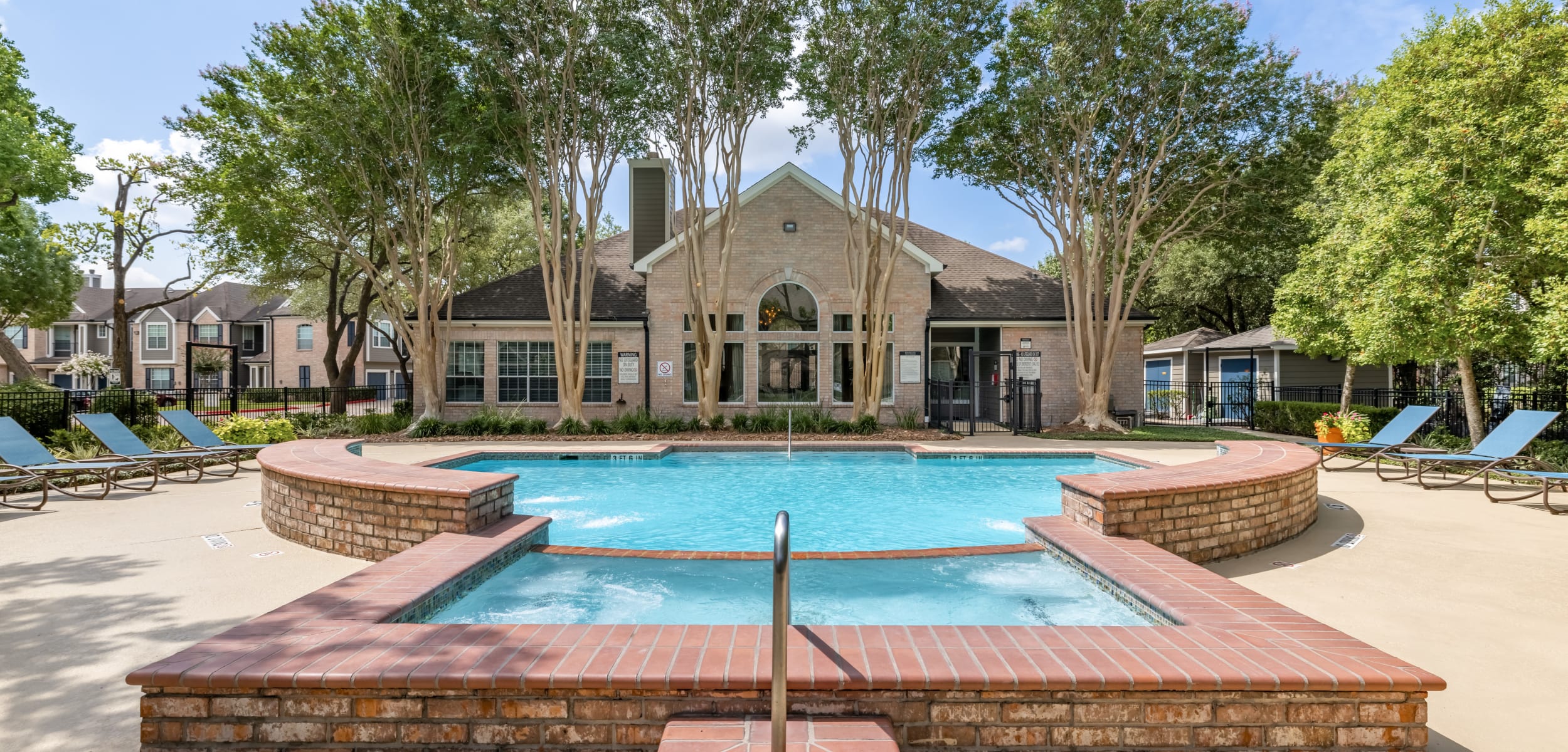 Pool with sun chairs at Marquis at Westchase in Houston Texas,