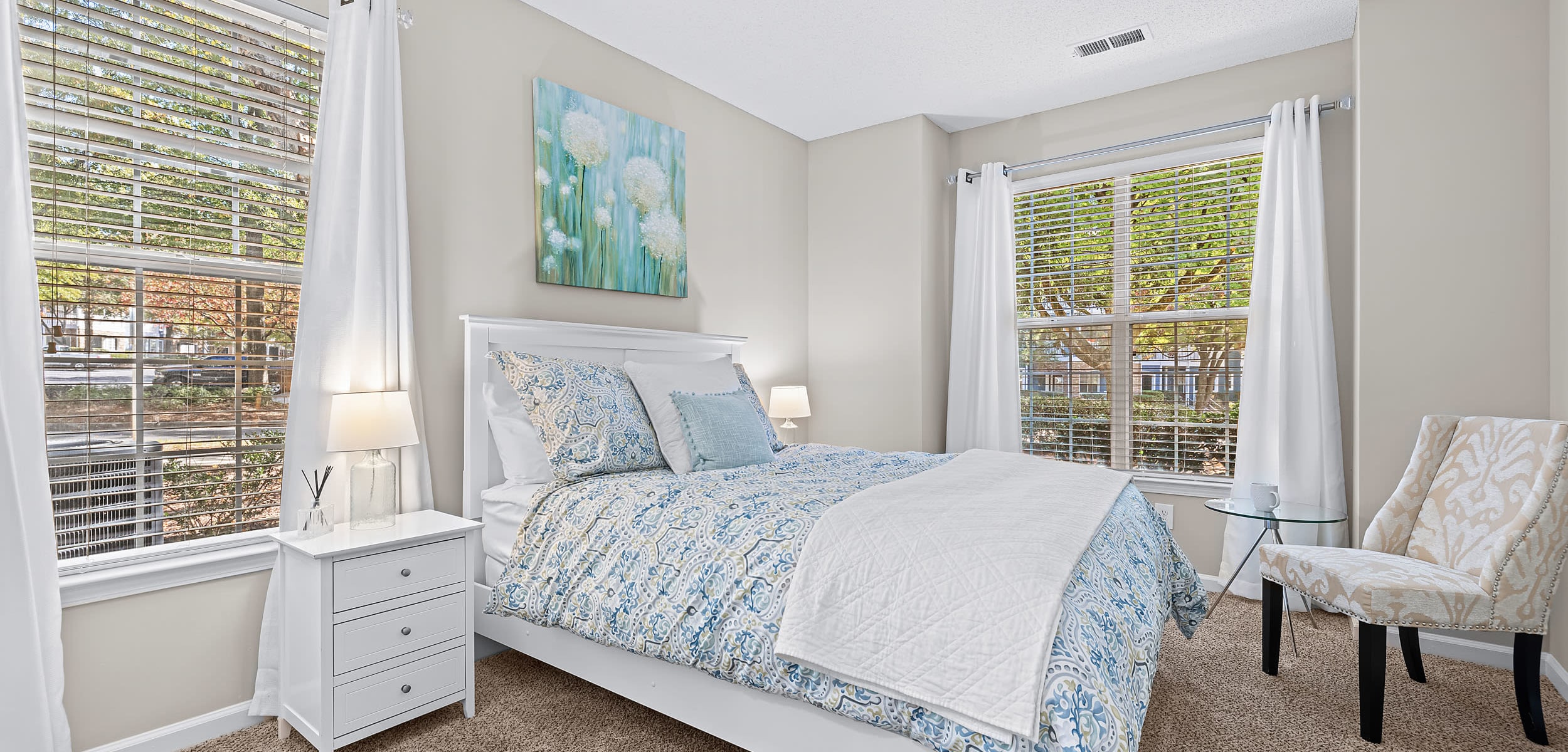 Bedroom with dual windows at Marquis on Edwards Mill in Raleigh, North Carolina