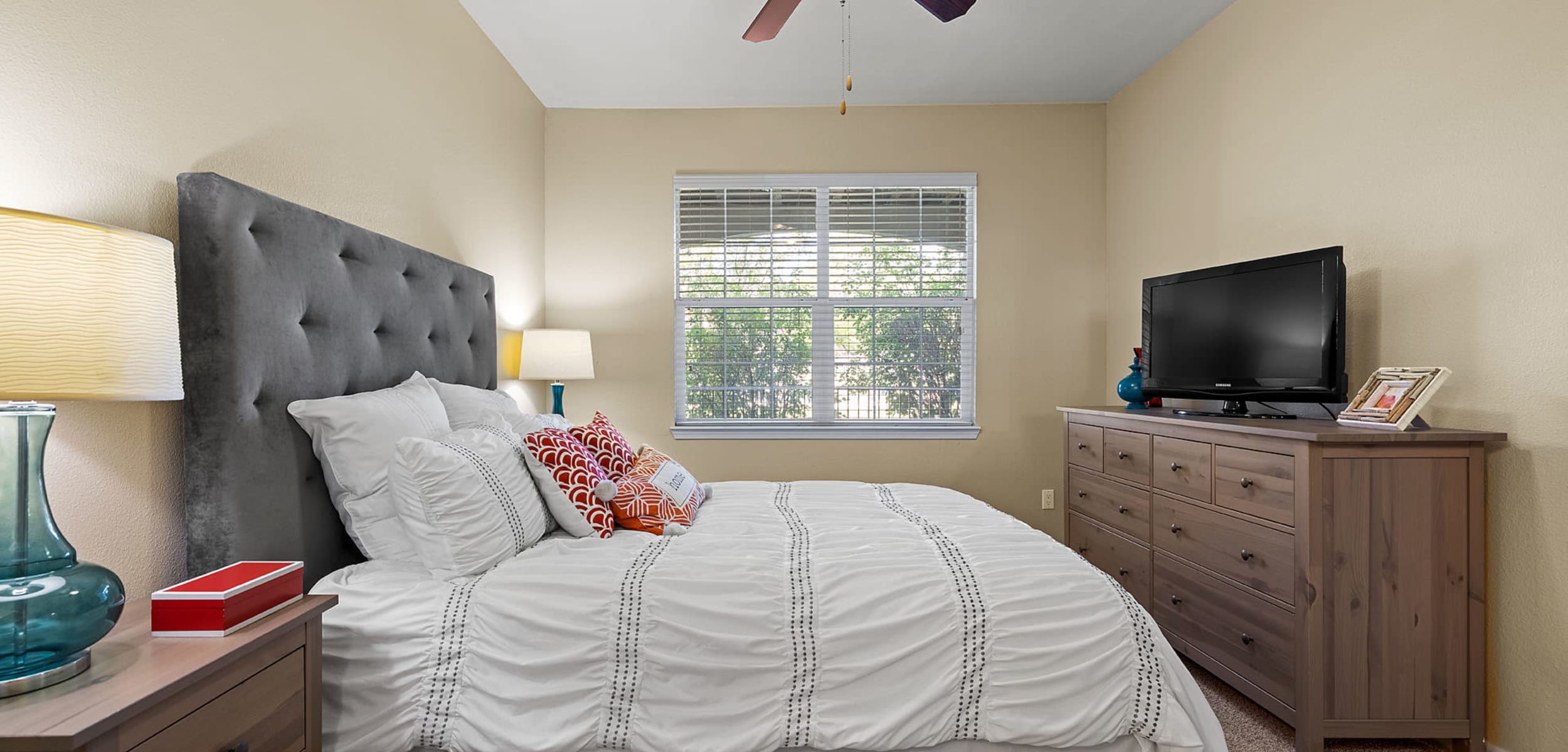 Bedroom with a ceiling fan at Marquis at Town Centre in Broomfield, Colorado