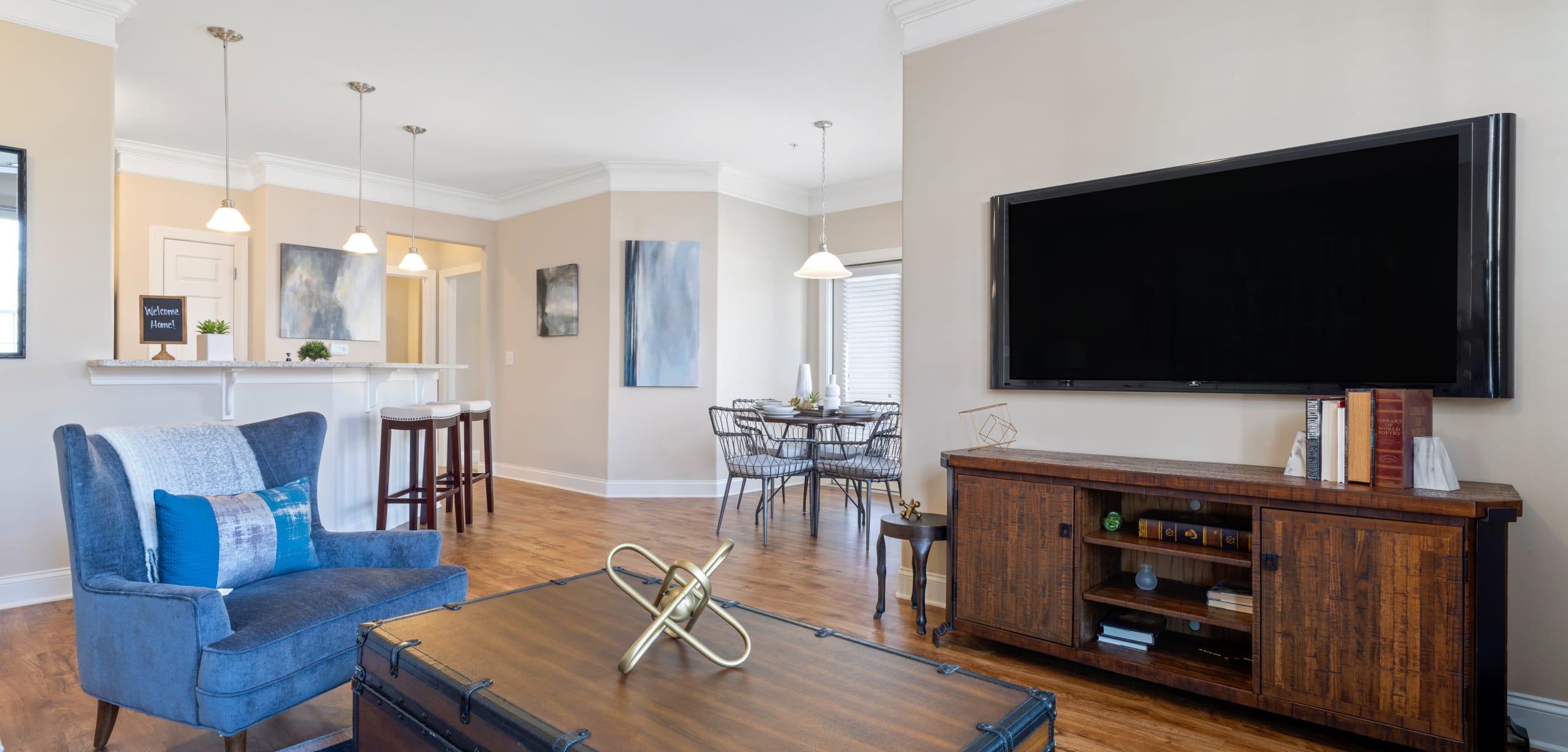 Model living space showcasing open layout at Marquis Ellis Crossing in Durham, North Carolina