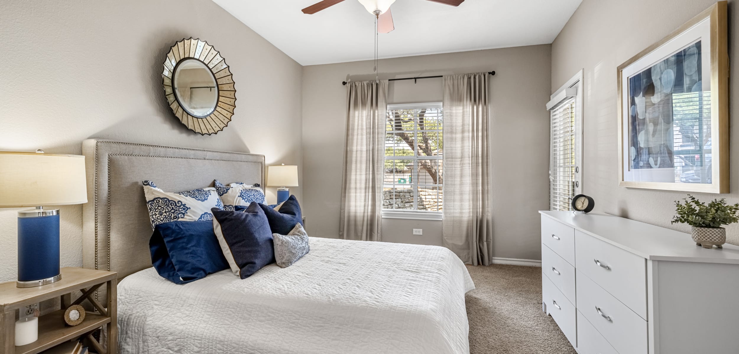 Bedroom with a ceiling fan at Marquis at Deerfield in San Antonio, Texas