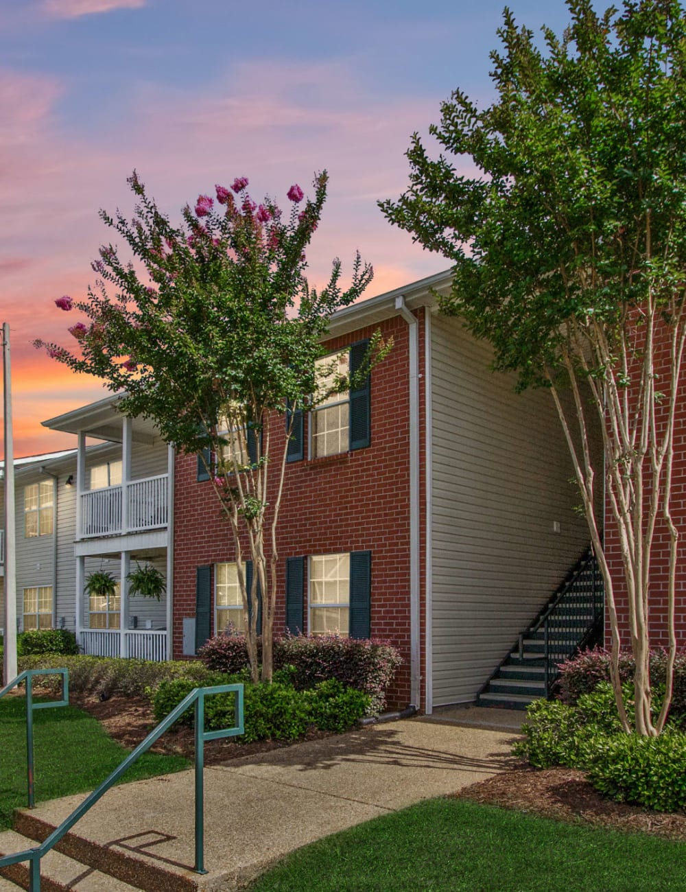 Exterior of an apartment building at dusk at The Gables in Ridgeland, Mississippi