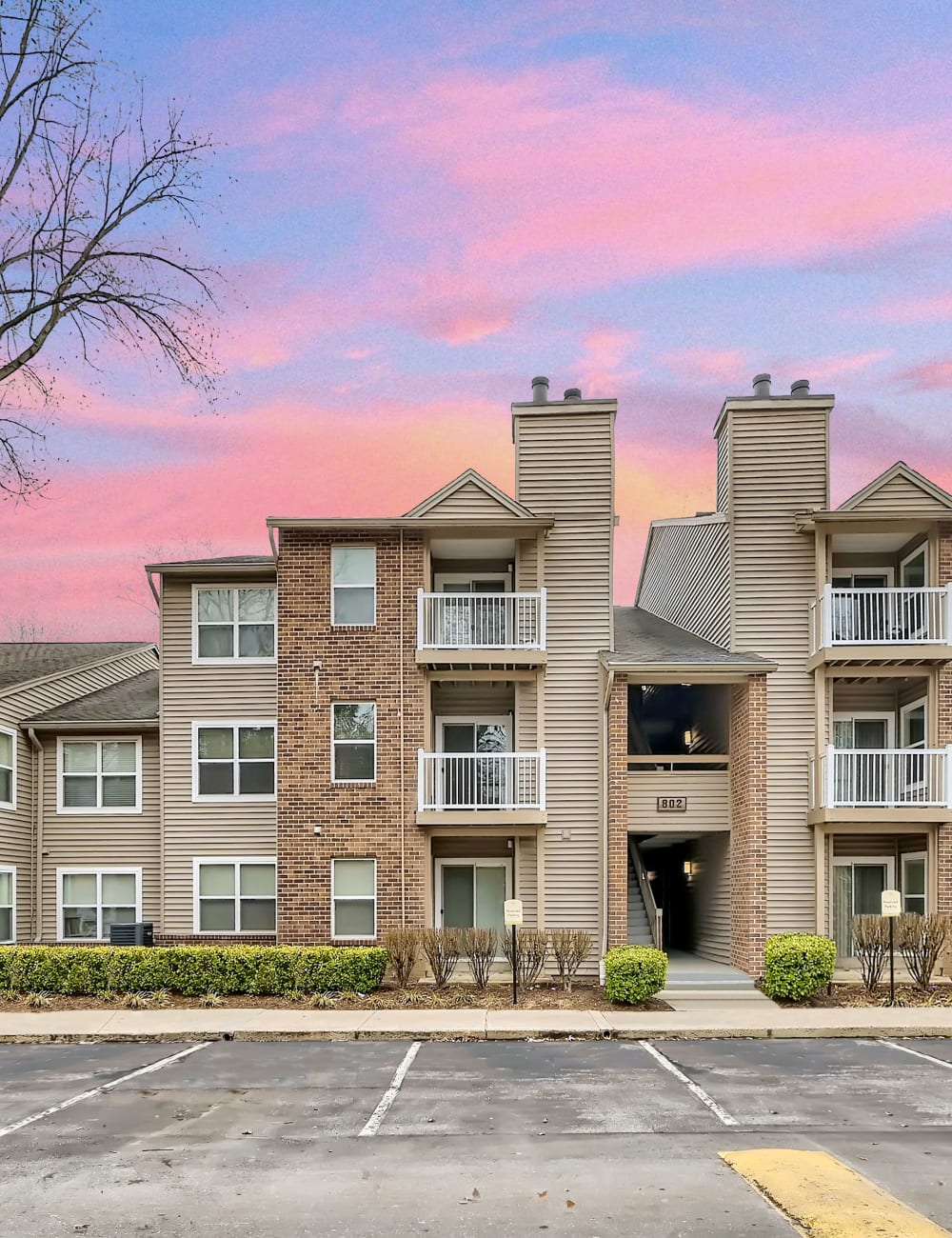 Exterior of an apartment building at dusk at Hunt Club in Gaithersburg, Maryland