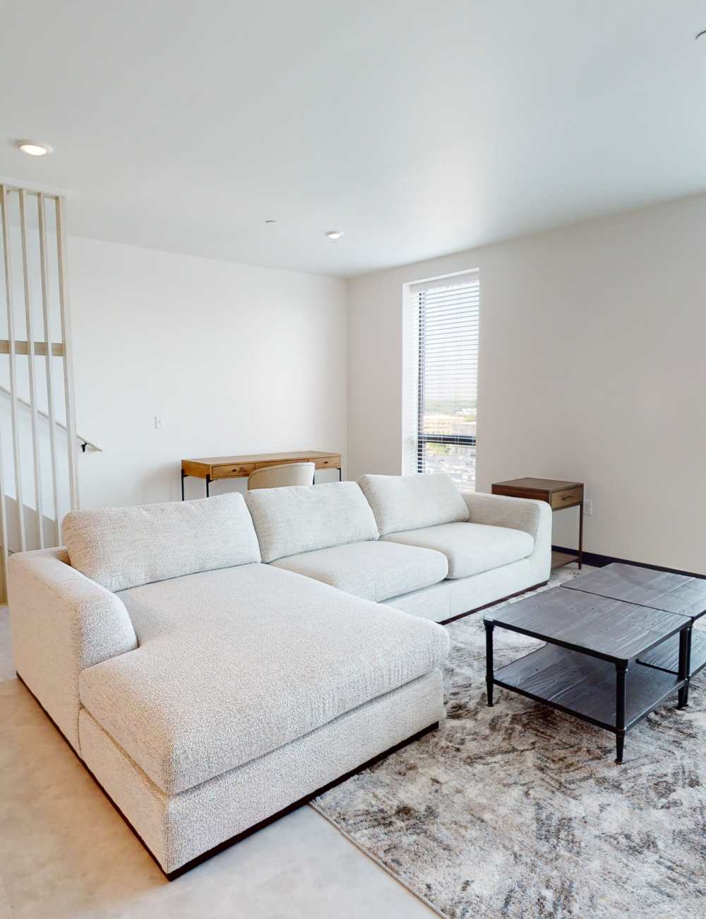 White sectional in living room at The Nest in Iowa City, Iowa