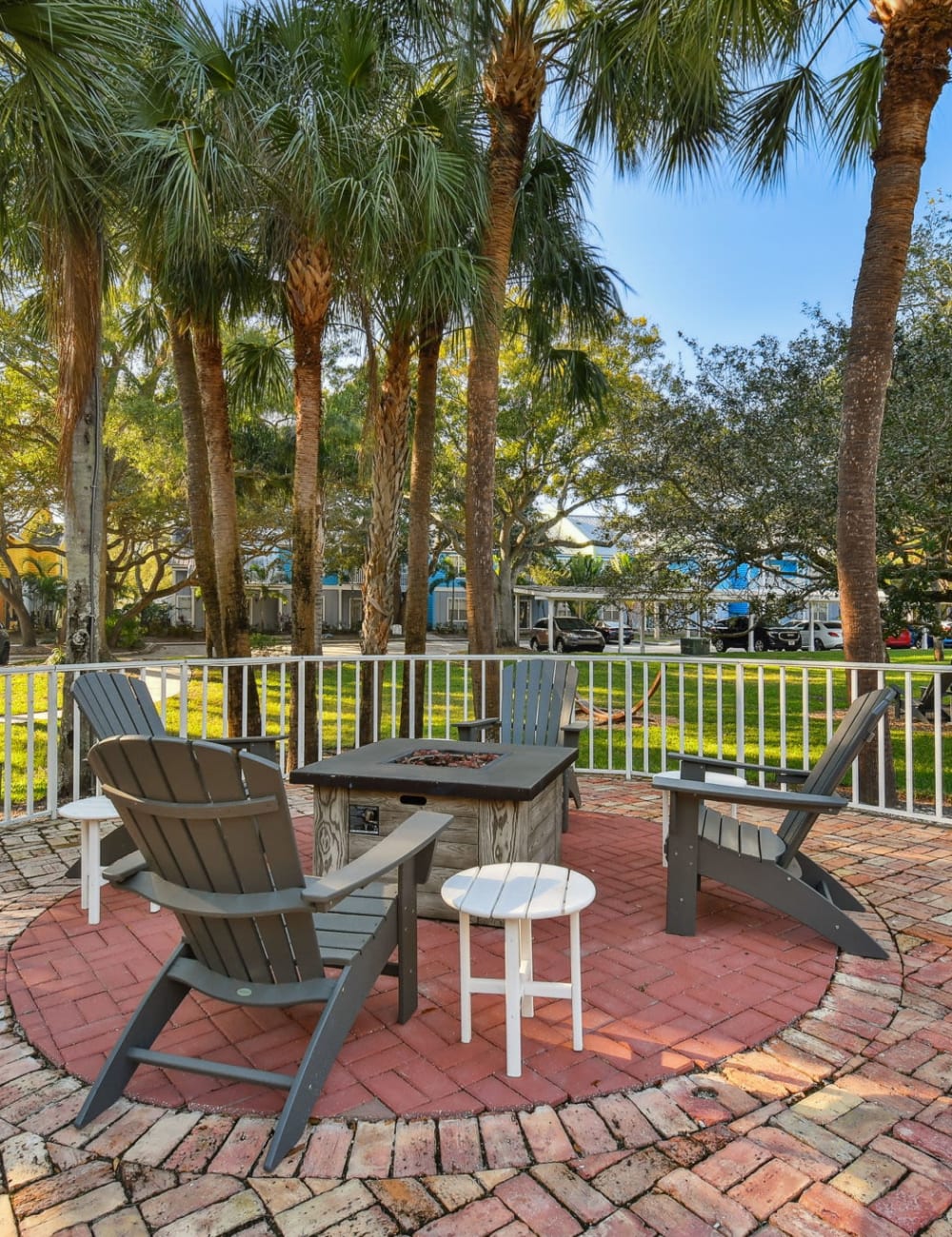Outdoor fireside seating by the community swimming pool at Mode at Ballast Point in Tampa, Florida