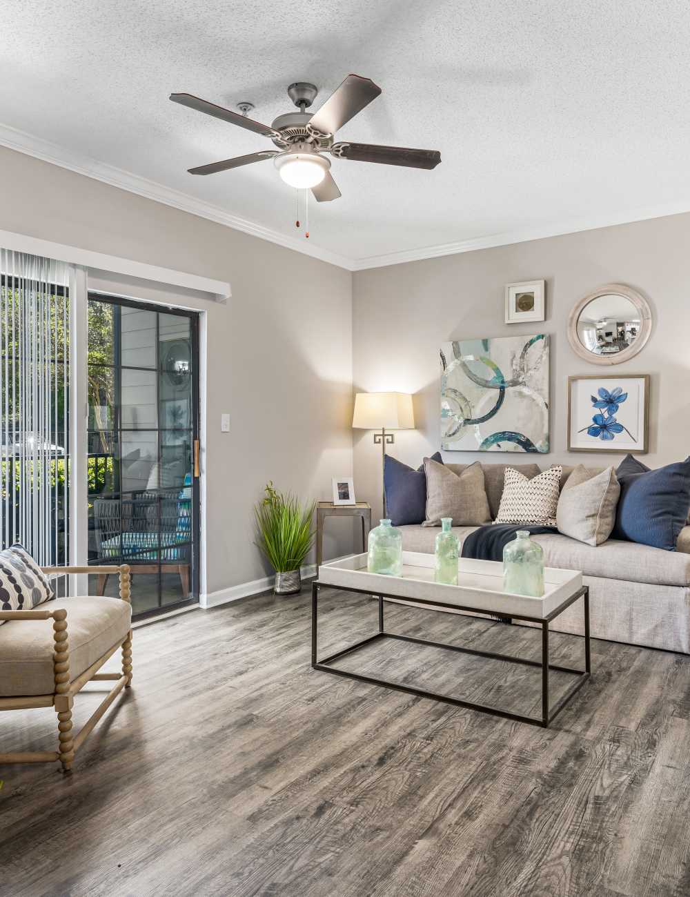 An apartment dining room and living room at The Oaks of St. Clair in Moody, Alabama