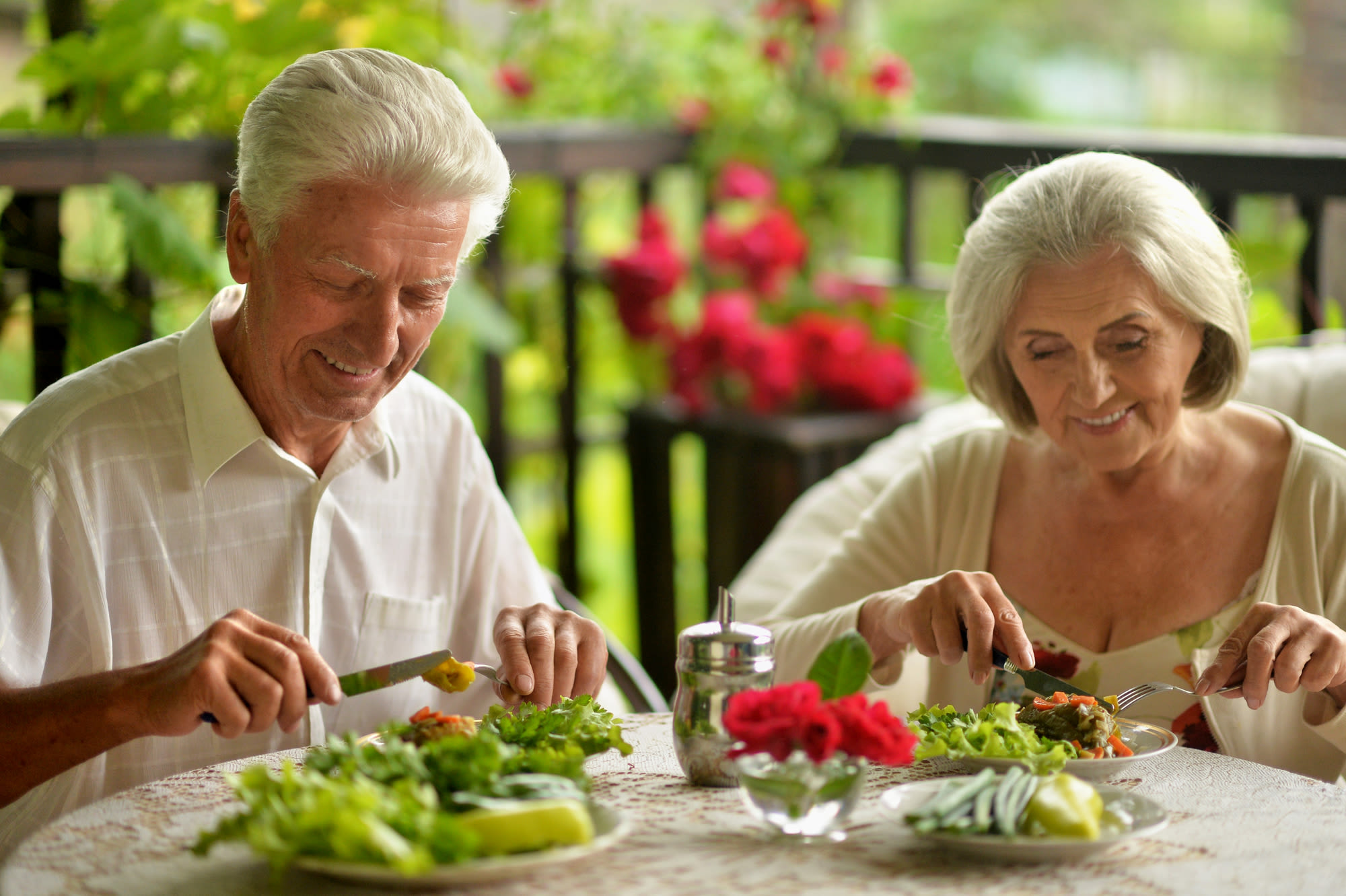 Resident couple eating a chef-prepared diner at The Iris Senior Living in Great Falls, Montana