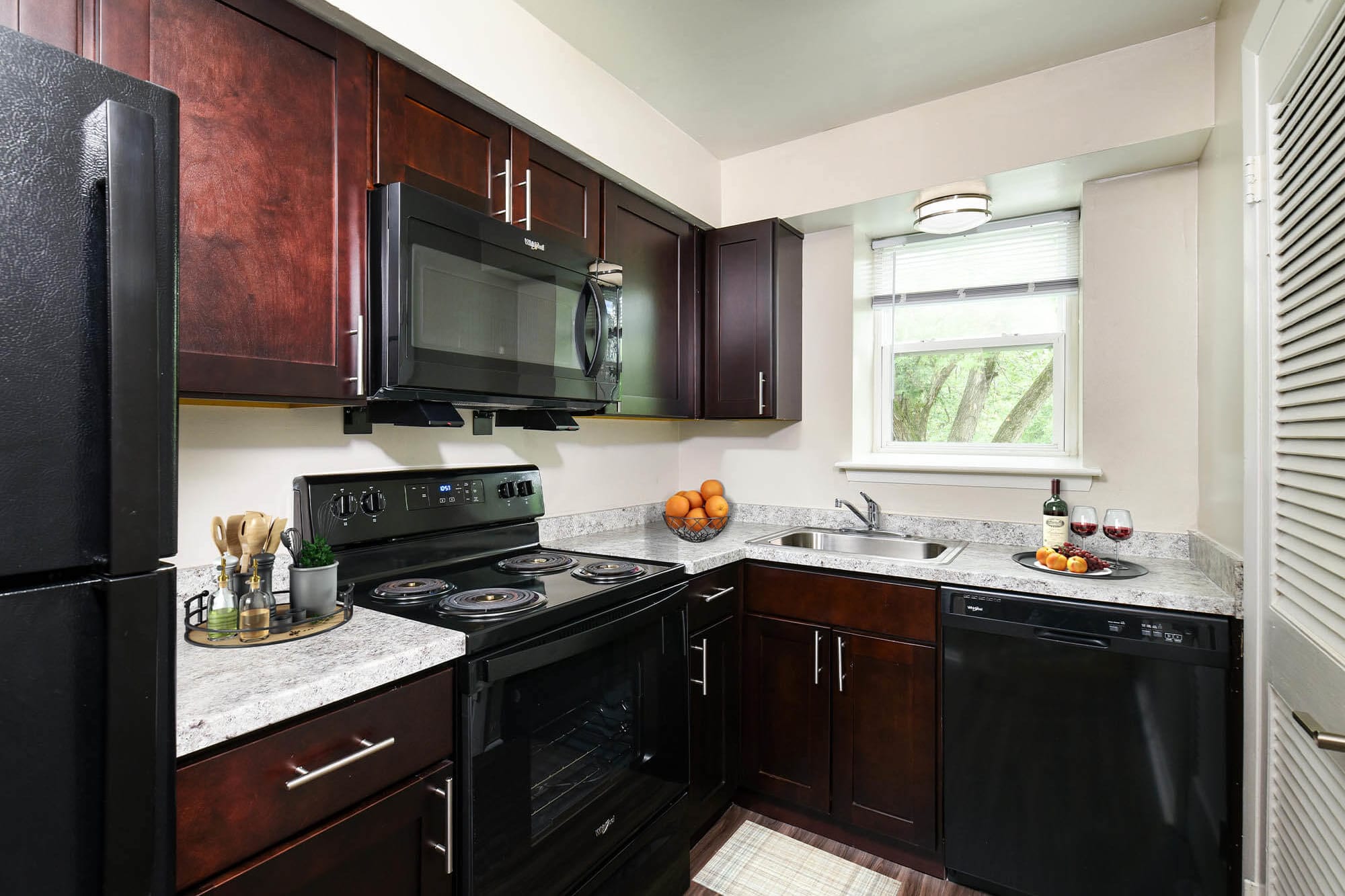 Resident preparing a meal in their new kitchen at Liberty Pointe in Newark, Delaware