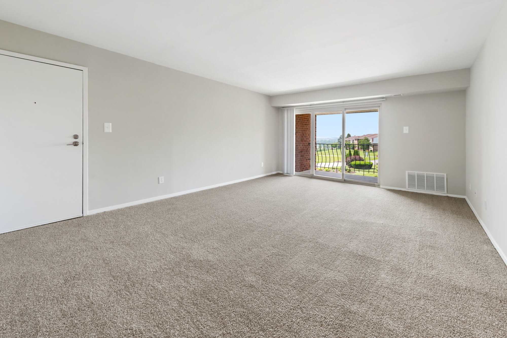 living room with sliding glass doors at Greenspring in York, Pennsylvania