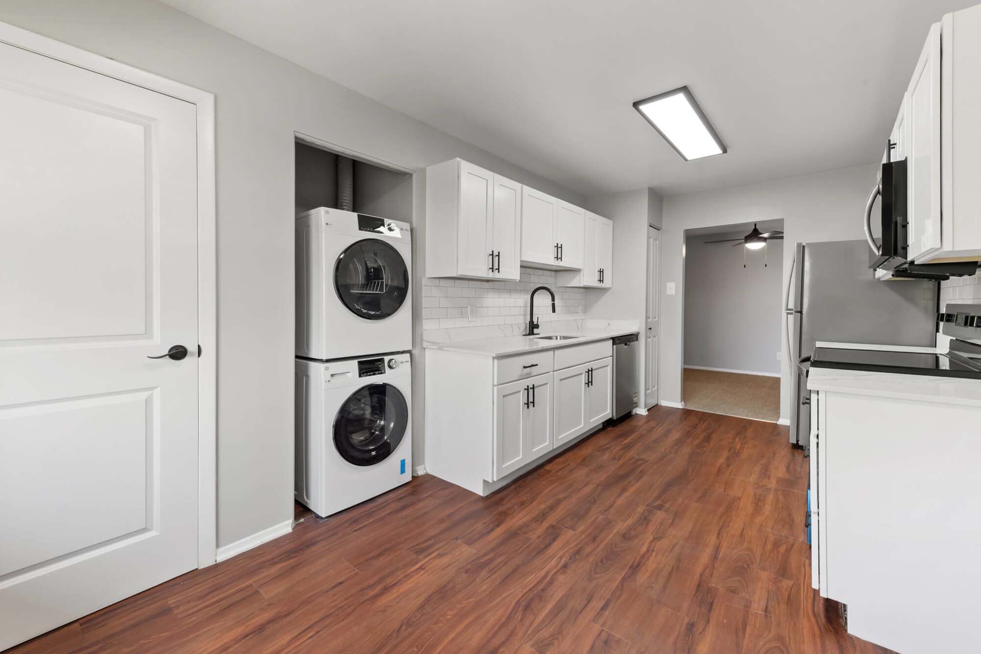 Renovated kitchen with in unit washer and dryer at Greenspring in York, Pennsylvania