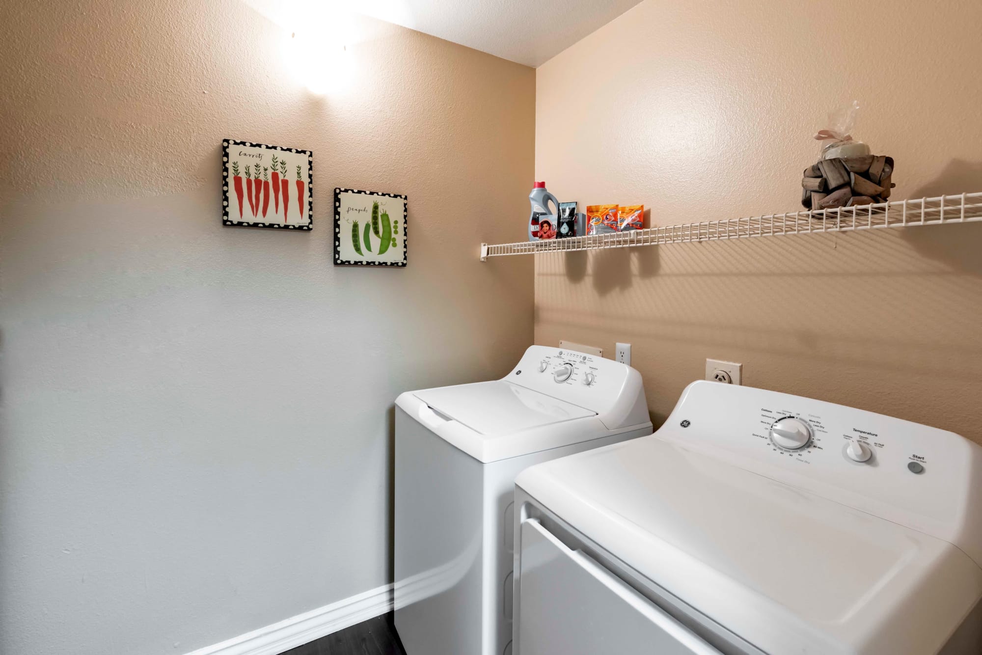 Washer and dryer in an apartment at Sierra Del Oro Apartments in Corona, California
