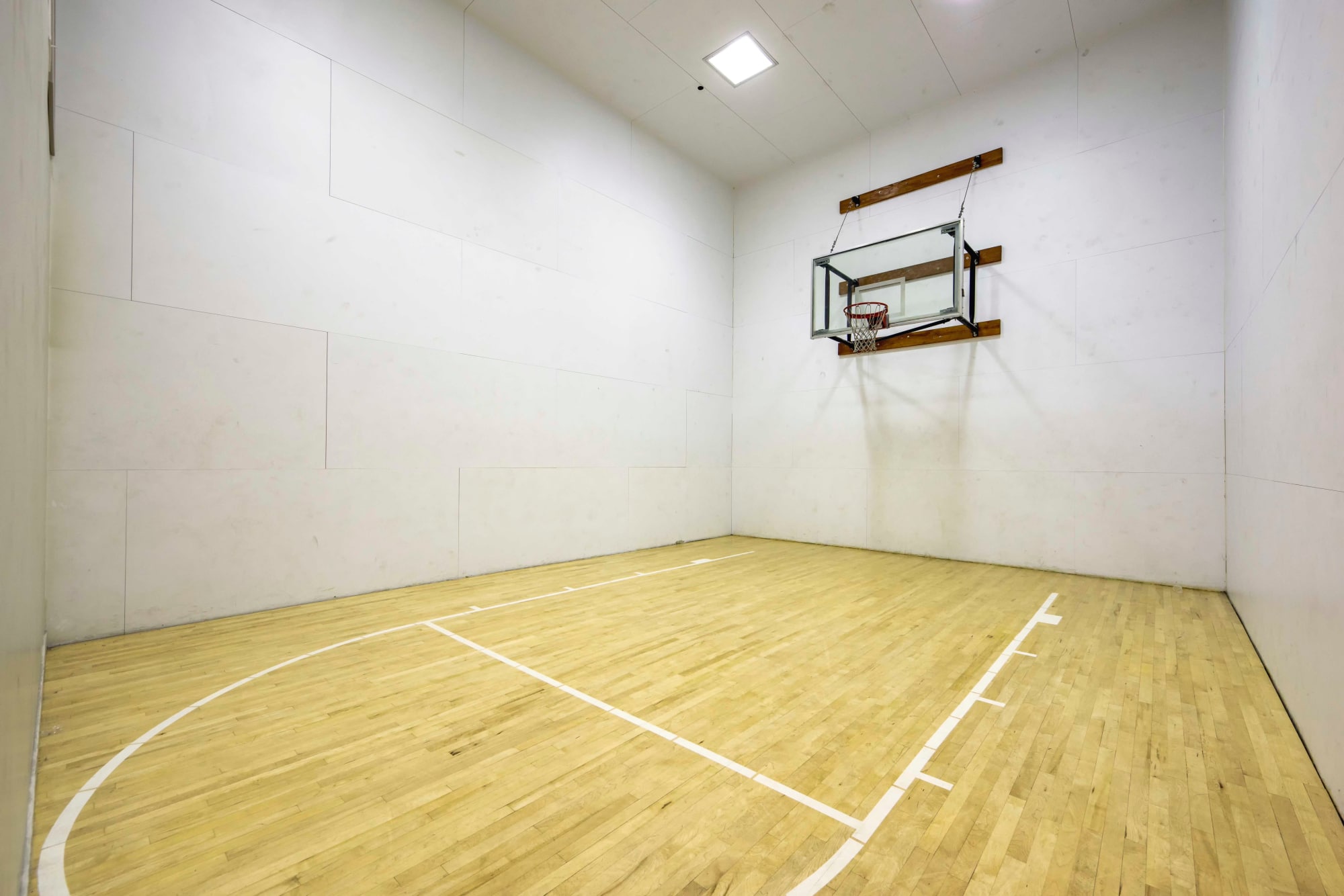 Indoor basketball court at Sierra Del Oro Apartments in Corona, California